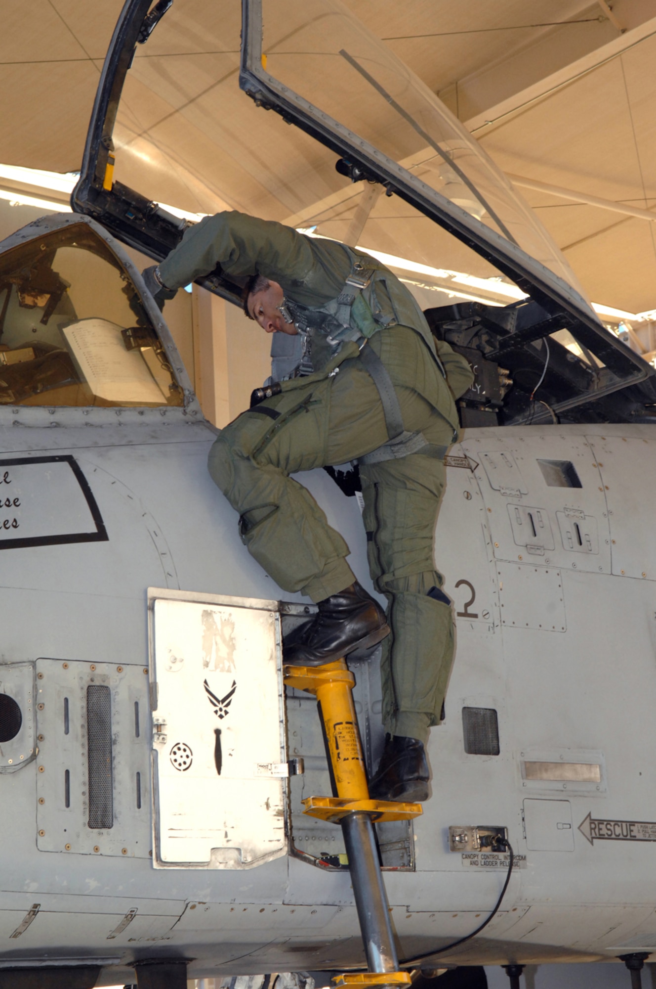 Lt. Col. Michael Millen, 354th Fighter Squadron commander, enters the cockpit of an A-10 A-model prior to take-off here May 15. Colonel Millen and Col. Kent Laughbaum, 355th Fighter Wing commander, flew the last two A-10 A-models belonging to the 354th FS to Hill Air Force Base, Utah, to be upgraded to A-10Cs. (U.S. Air Force photo by Airman 1st Class Noah R. Johnson)