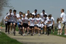 MINOT AIR FORCE BASE, N.D. -- Kids, ninth-grade and older, including Airmen volunteers, begin their race at the America's Kids Run May 17 at Bud Ebert Park here. (U.S. Air Force photo by Airman 1st Class Benjamin Stratton)