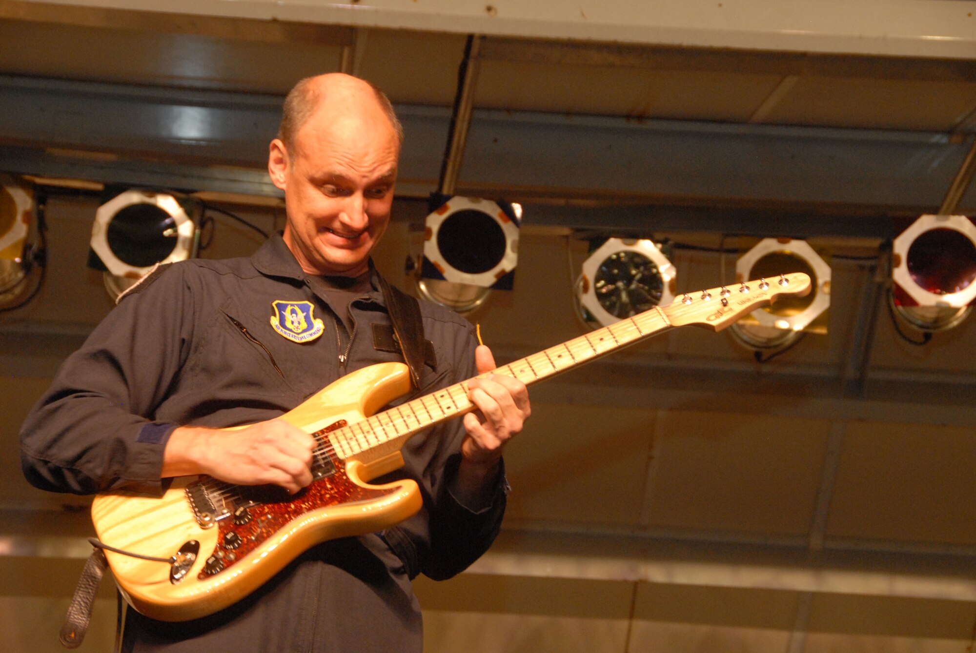 Tech. Sgt. Rob Walker, a guitarist for the Band of the United States Air Force Reserve, jams out during Caribbean Tour 2008. The band was accompanied by Puerto Rican meringue singer Melina Leon. They made stops at Guatanamo Bay Naval Base, Cuba and Ft. Buchanan, Puerto Rico. (Air Force photo/Master Sgt. Chance Babin)