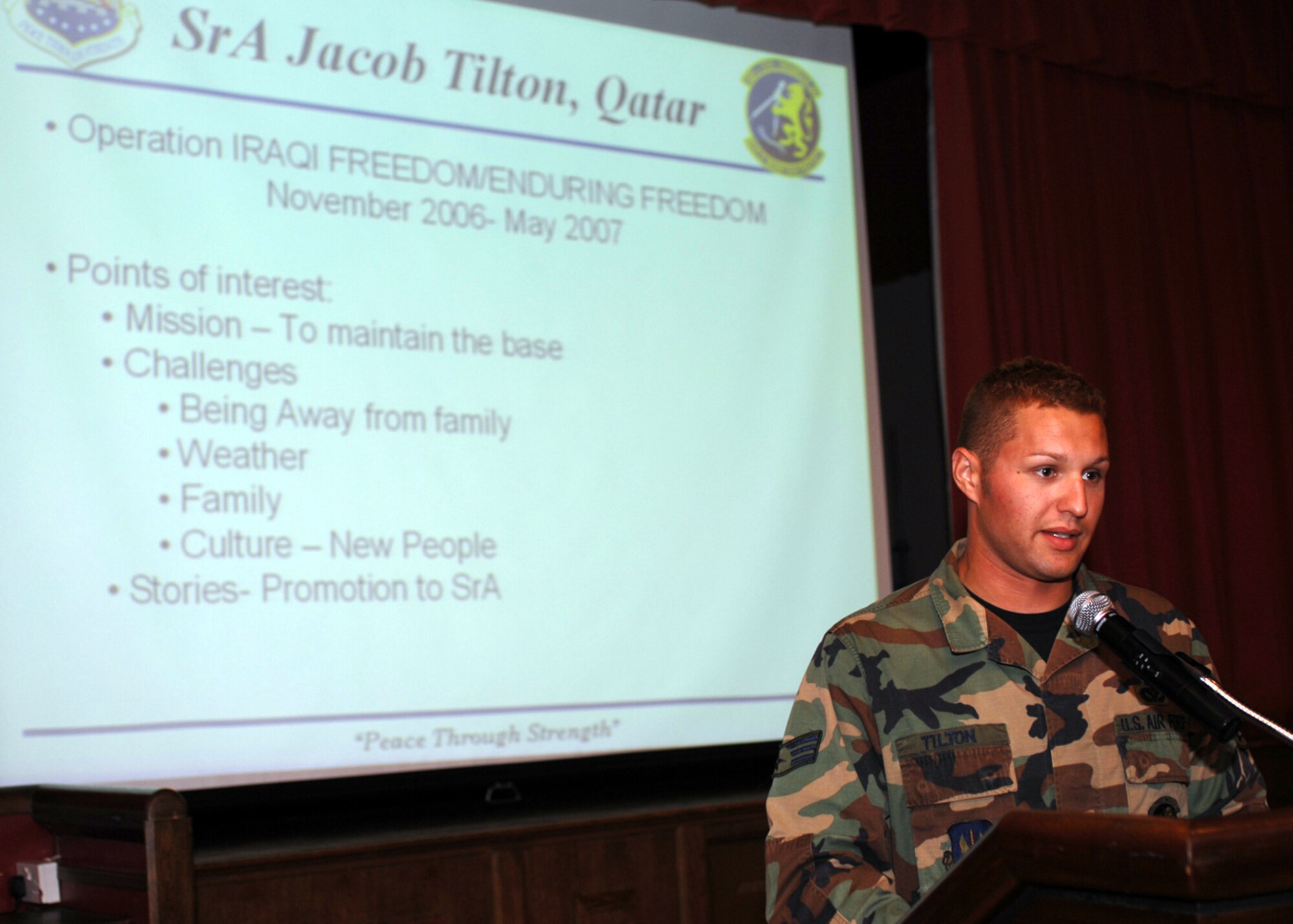 Senior Airman Jacob Tilton,100th Civil Engineer Squadron, speaks during the Warrior Stories luncheon at the Galaxy Club May 13. During his presentation the Airman spoke of his journey as a “Dirt Boy” complete with a light-hearted, three- minute video and jokingly compared the heat in Qatar to “standing in front of a hot oven and having sand thrown at you.”  (U.S. Air Force photo by Master Sgt. Sarah Frankenhoff)            