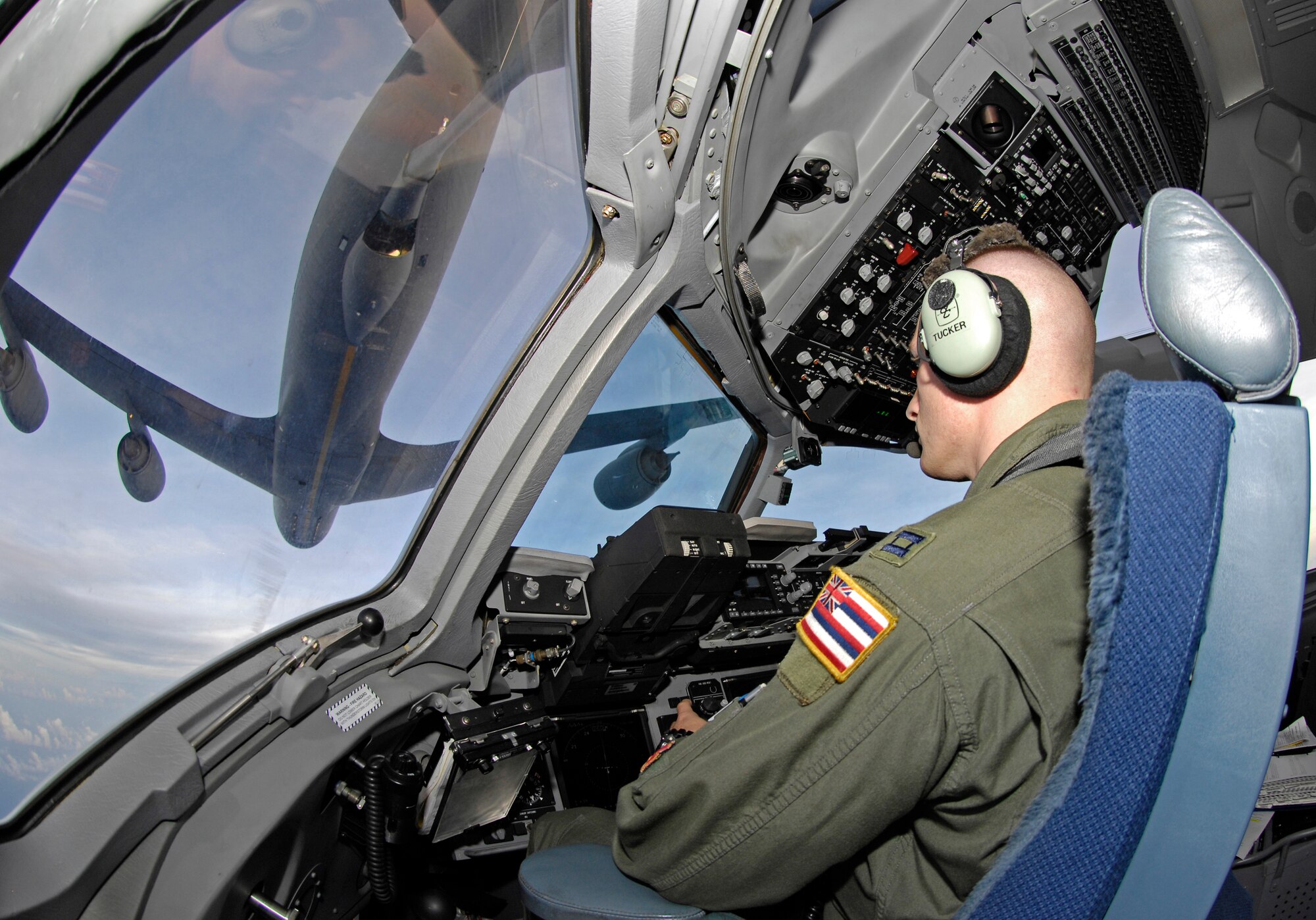 Capt. John Tucker, assigned to the Hawaii Air National Guard's 204th Airlift Squadron at Hickam Air Force Base, Hawaii, prepares to engage a C-17 Globemaster III in aerial refueling with a KC-135 from the 909th Air Refueling Squadron out of Kadena Air Base, Japan, while en route to China May 17, 2008. A U.S. Pacific Command mission employed one C-17 from the 15th Airlift Wing at Hickam and another from the 3rd Wing at Elmendorf Air Force Base, Alaska, to deliver nearly 200,000 pounds of cargo in the wake of a devastating earthquake. (US Air Force photo/Tech. Sgt. Chris Vadnais)