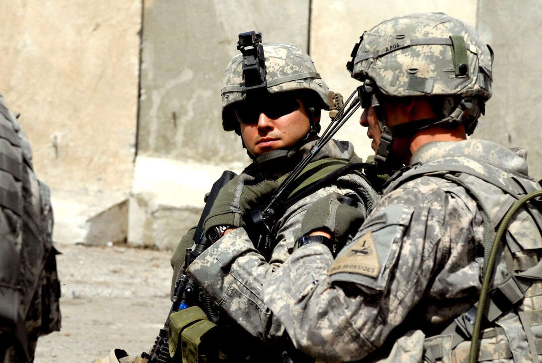 U.S. Army Capt. Erik Oksenvaag talks with U.S. Army 1st Lt. Ryan Poole ...