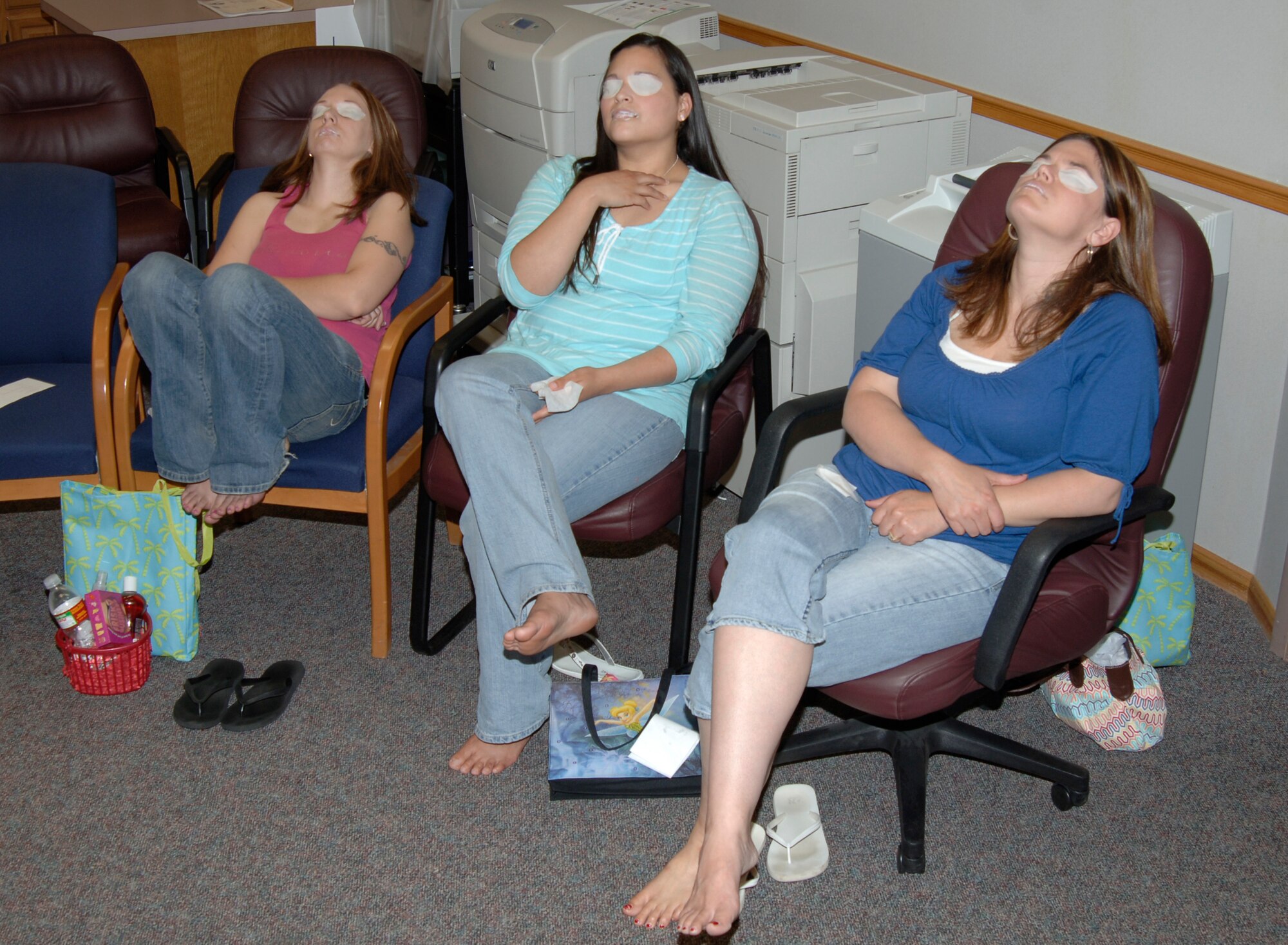 MCCONNELL AIR FORCE BASE, Kan. -- Crystal Rodriguez, Cindy Hood, and Angie Ward, Team McConnell members take part in a spa treatment during the Enlisted Spouse Club’s Mom’s Retreat at the Airman and Family Readiness Center, May 17. The ESC holds the Mom’s Retreat once a year around Mother’s Day in order to show recognition for all that a military mother/spouse accomplishes. (Photo by Airman Justin Shelton)