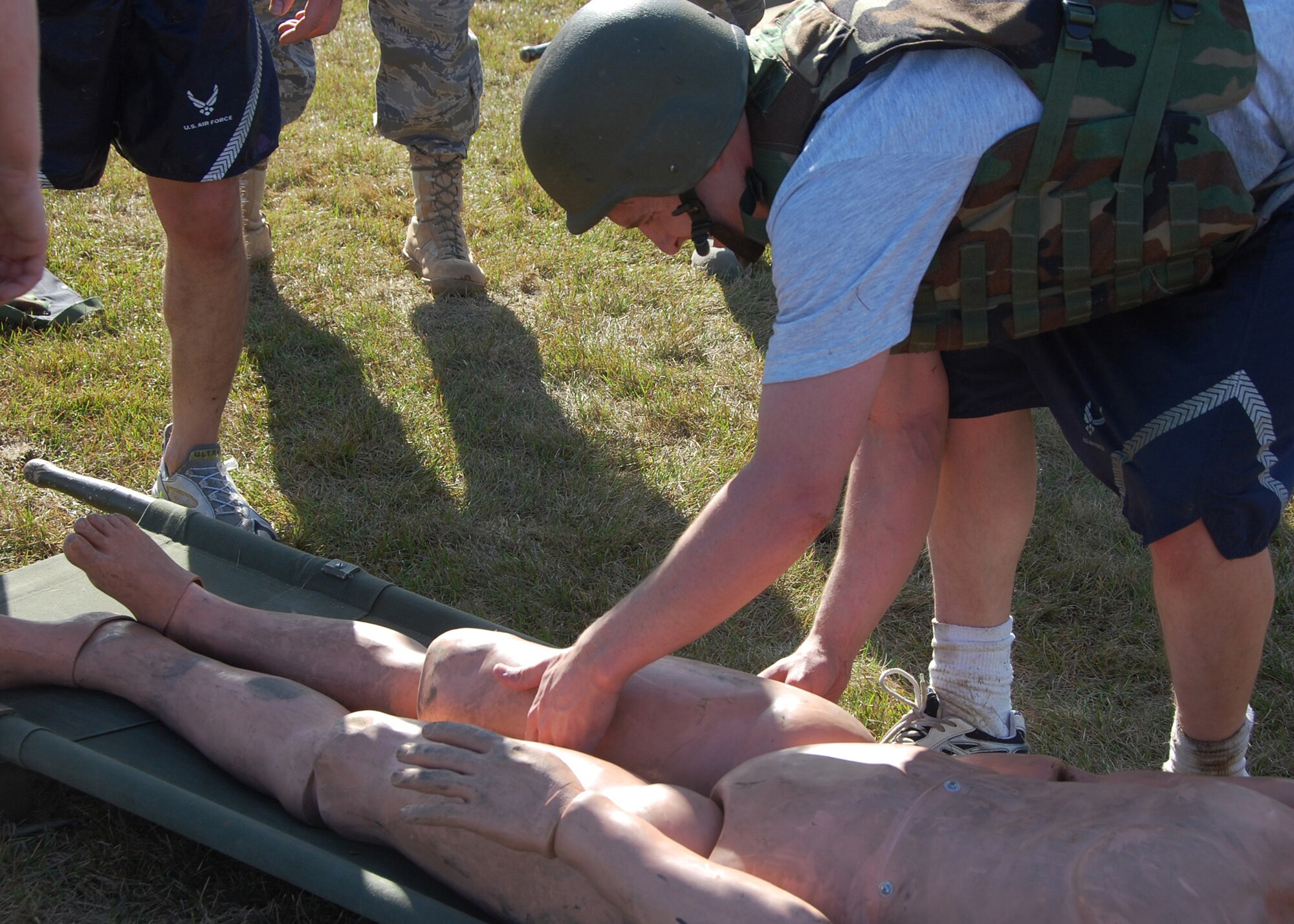 Airman 1st Class Matthew Leeper, 354th Security Forces Squadron ?Cops? teammate, positions a 180-pound dummy on a stretcher before his team does a litter carry May 14, 2008, at Eielson AFB, Alaska. The 354th SFS hosted a Police Week Warrior Challenge consisting of a variety of physical and mental obstacles, such as a 1.5-mile run, a keep-in-memory game, various calisthenics and low crawling a total of 150 meters. The 354th SFS ?Cops? came in second place to the 354th Maintenance Squadron ?Styers Strikers? with a time of 36:44. (U.S. Air Force photo by Airman 1st Class Nora Anton)