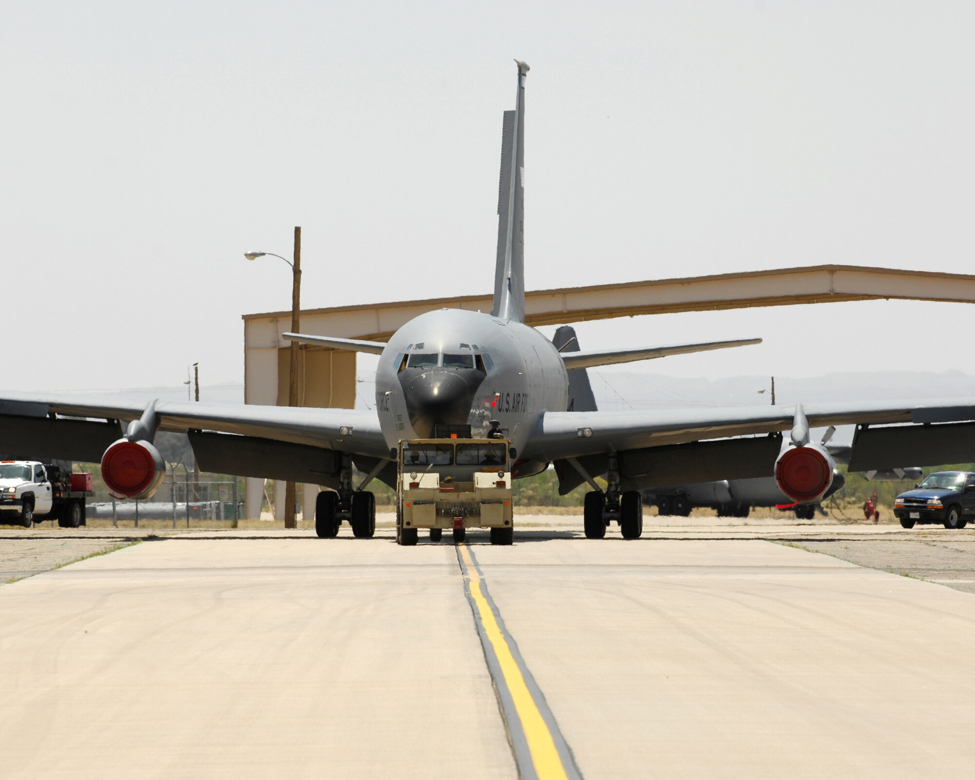 Air Force KC-135 E model aircraft, tail number 0327 is towed by personnel from the 309th Aerospace Maintenance and Regeneration Group from the active flight line at Davis-Monthan Air Force base to the storage area.  The 50 year old aircraft was delivered to the group for long term storage at the 2,600 acre facility after serving with the 151st Air Refueling Wing, Utah Air National Guard for more than 20 years.  

The 309 AMARG is a one-of-a-kind specialized facility within the Air Force Materiel Command's 309th Maintenance Wing at Hill AFB, Utah. The 309 AMARG provides critical aerospace maintenance and regeneration capabilities for Joint and Allied/Coalition warfighters in support of global operations and agile combat support for a wide range of military operations.

U.S. Air Force photo by:  Master Sgt. Burke Baker