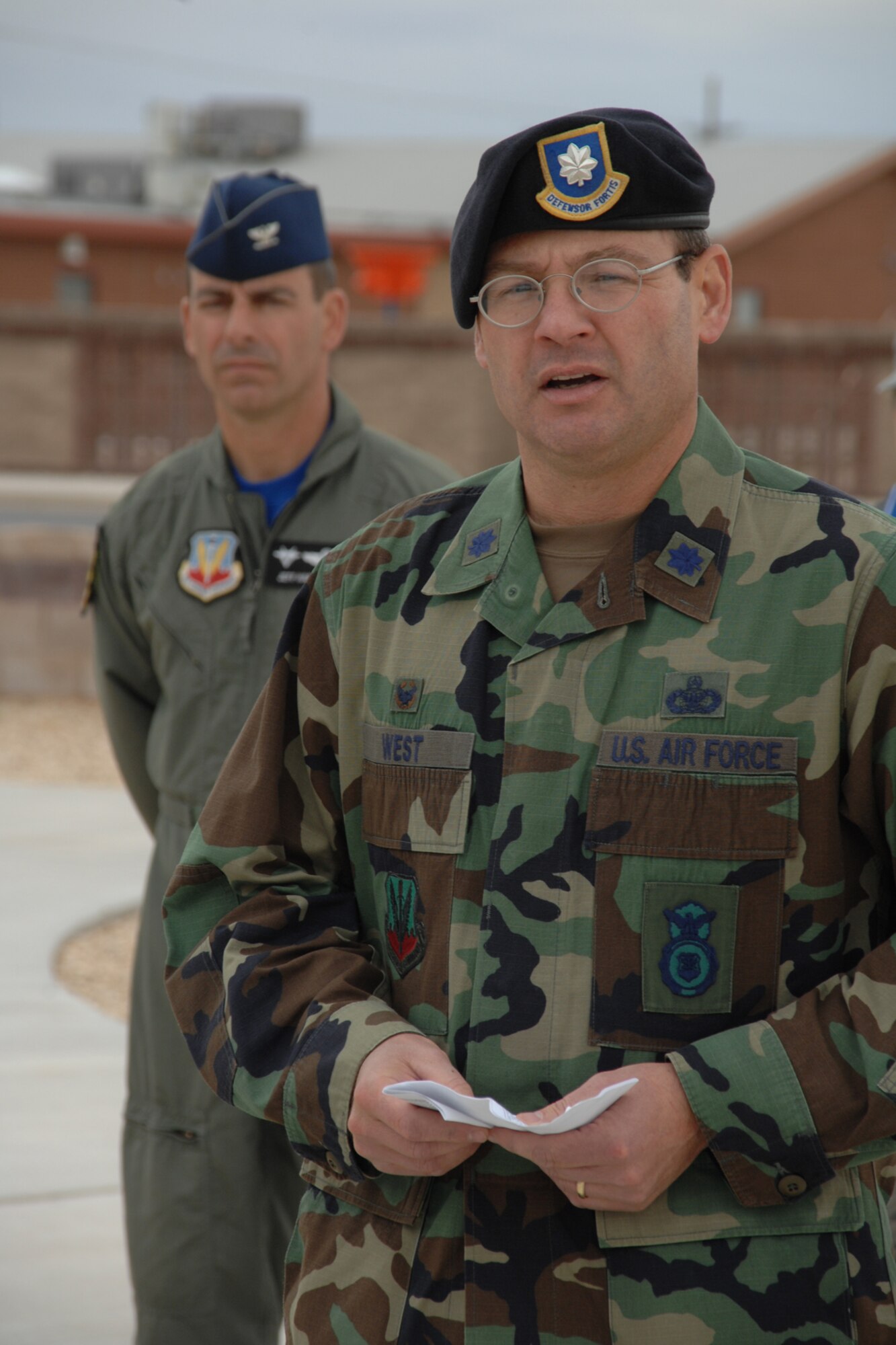 Lt. Col. John West, 49th Security Forces Squadron commander, reads the names of fallen defenders lost during combat in Iraqi Freedom and Enduring Freedom during a National Police Week Remembrance ceremony May 16 at Holloman Air Force Base, N.M. Named were Airman 1st Class Elizabeth N. Jacobson, 17th Security Forces Squadron, Tech. Sgt. Jason L. Norton, 3rd Security Forces Squadron, Staff Sgt. Brian McElroy, 3 SFS, Airman 1st Class Carl Jerome Ware Jr., 15th Security Forces Squadron, Airman 1st Class Leebernard E. Chavis, 824th Security Forces Squadron, Staff Sgt. John T. Self, 314th Security Forces Squadron, Airman 1st Class Jason D. Nathan, 48th Security Forces Squadron and Staff Sgt. Travis L. Griffin, 377th Security Forces Squadron. (U.S. Air Force photo/Airman 1st Class Jamal D. Sutter)