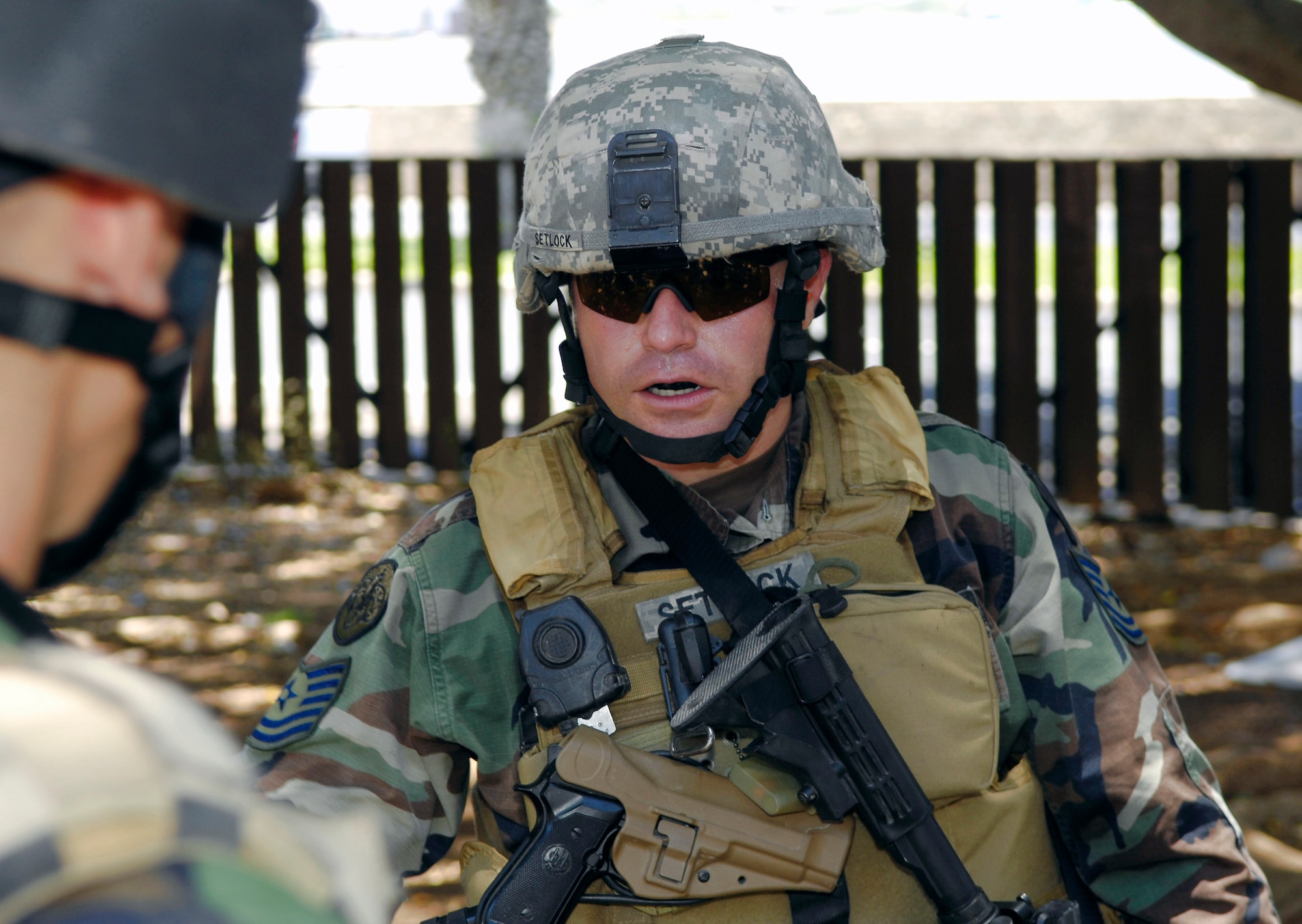 Tech. Sgt. Richard Setlock, a joint terminal attack controller, briefs his plan of attack to an instructor during close-quarters battle training May 7 at Hickam Air Force Base, Hawaii.  The JTACs were using an old housing area on Hickam AFB to conduct realistic training in an urban environment.  Sergeant Setlock is assigned to the 25th Air Support Operations Squadron at Wheeler Army Air Field, Hawaii. (U.S. Air Force photo/Tech. Sgt. Chris Vadnais)