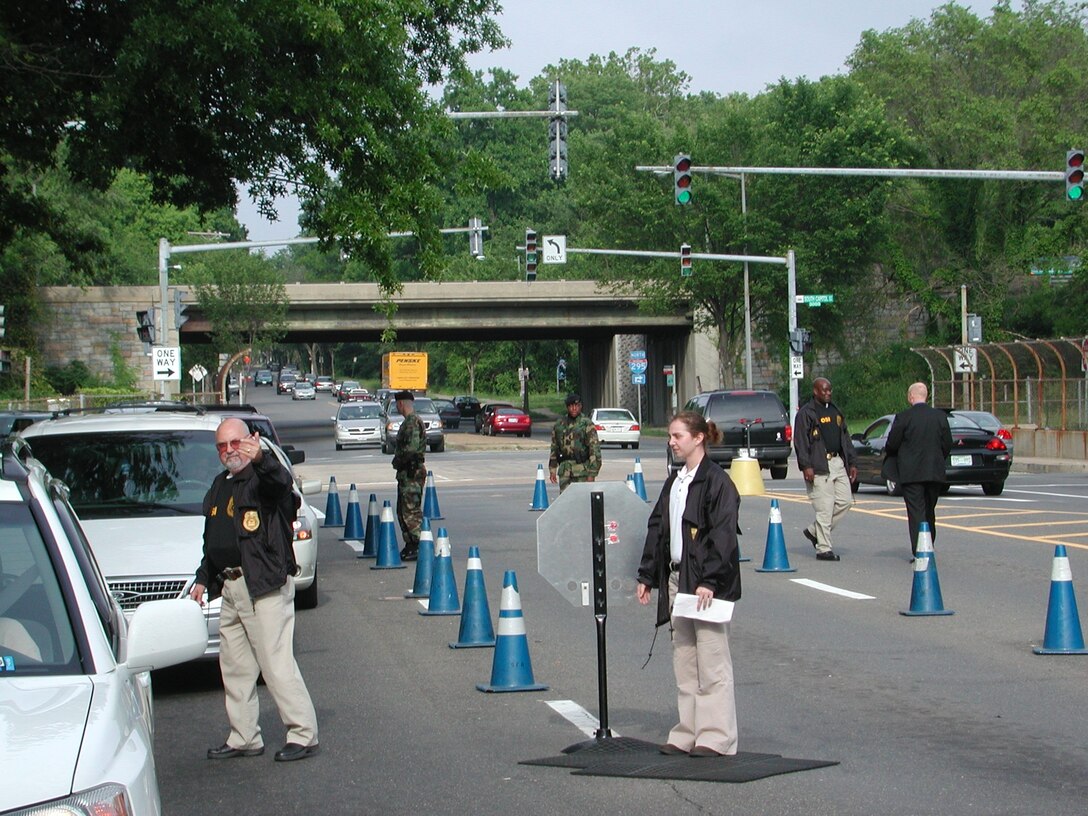 AFOSI Special Agents participate in a random vehicle search at one of the gates at Bolling Air Force Base, Md.(U.S. Air Force photo)