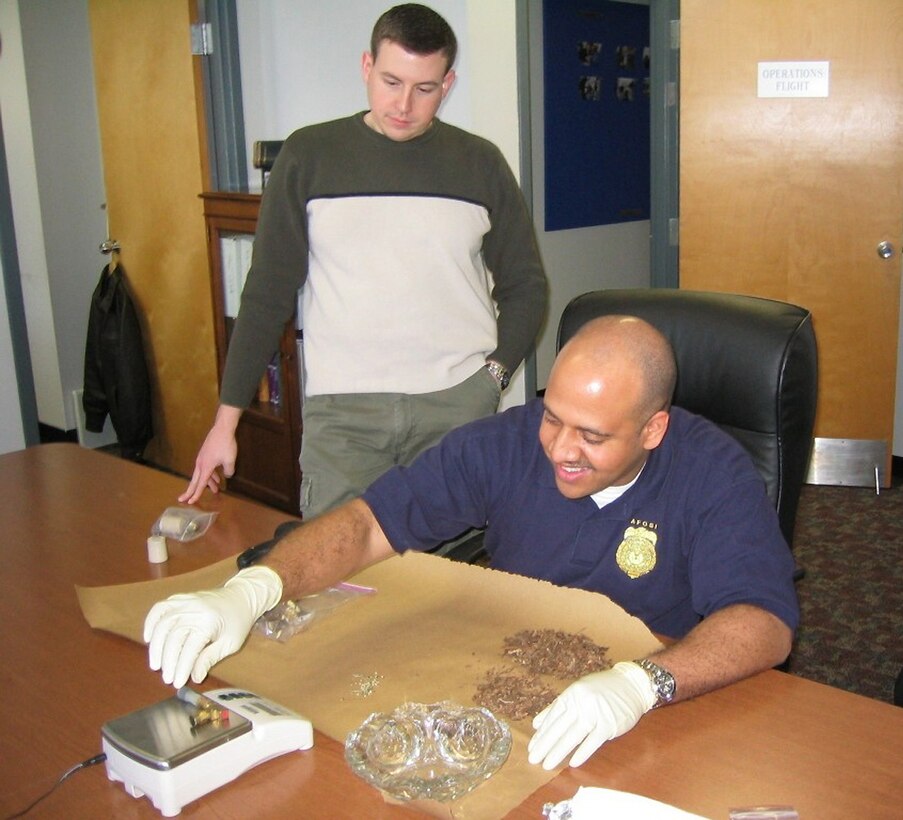 AFOSI Agents process drug evidence (U.S. Air Force photo)