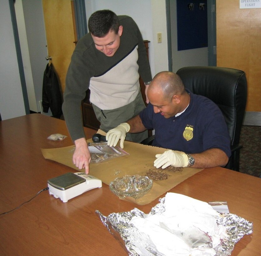 AFOSI Agents process drug evidence (U.S. Air Force photo)