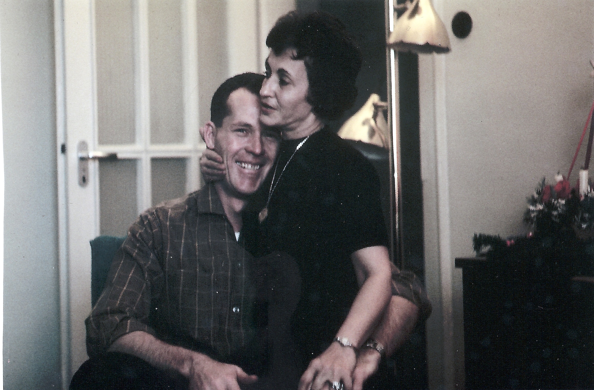 This snapshot of Mary and Maj. Robert F. Woods was taken in the early 1960s while they were stationed at Weisbaden Air Base, Germany. On Nov. 30, 2007, the Air Force announced that Major Woods, along with co-pilot Capt. Johnnie C. Cornelius, were identified and their remains returned to the United States from Vietnam.  On June 26, 1968, Major Woods and Captain Cornelius were flying a visual reconaissance mission over Quang Binh Province, Vietnam, when their O-2A Skymaster aircraft crashed in a remote mountainous area.  Major Woods was buried with full military honors April 9, 2008, at Arlington National Cemetery nearly 40 years after he disappeared in the crash. (Photo courtesy of the Woods family)