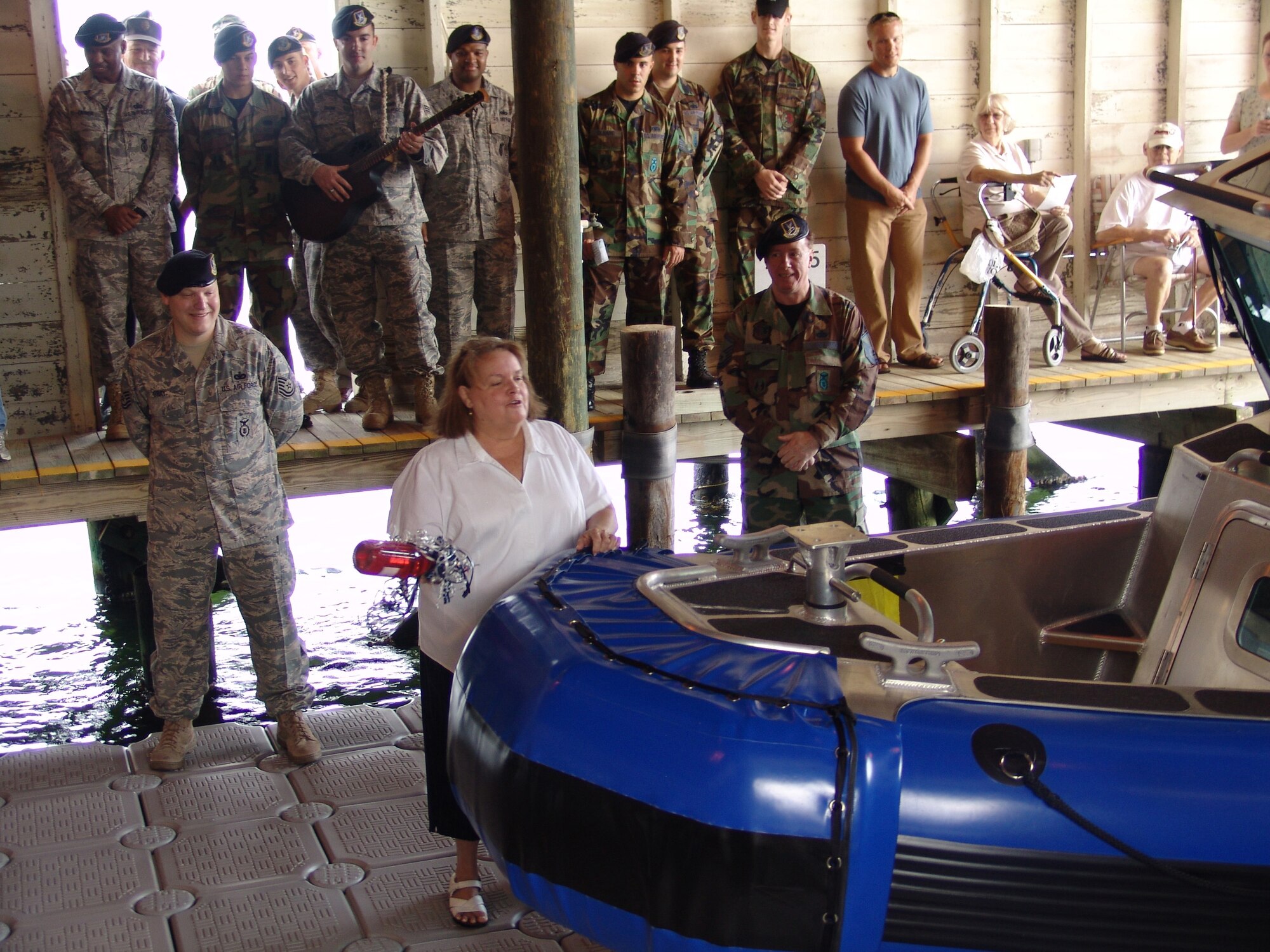 EGLIN AIR FORCE BASE, Fla. -- Elizabeth "Libby" Moseley gets ready to christen the 96th Security Forces "Defender 25" before its launching.  Ms. Moseley was instrumental in procuring the funding for the boat.  The boat will provide additional response capabilities for the police. (USAF photo by Lois Walsh)