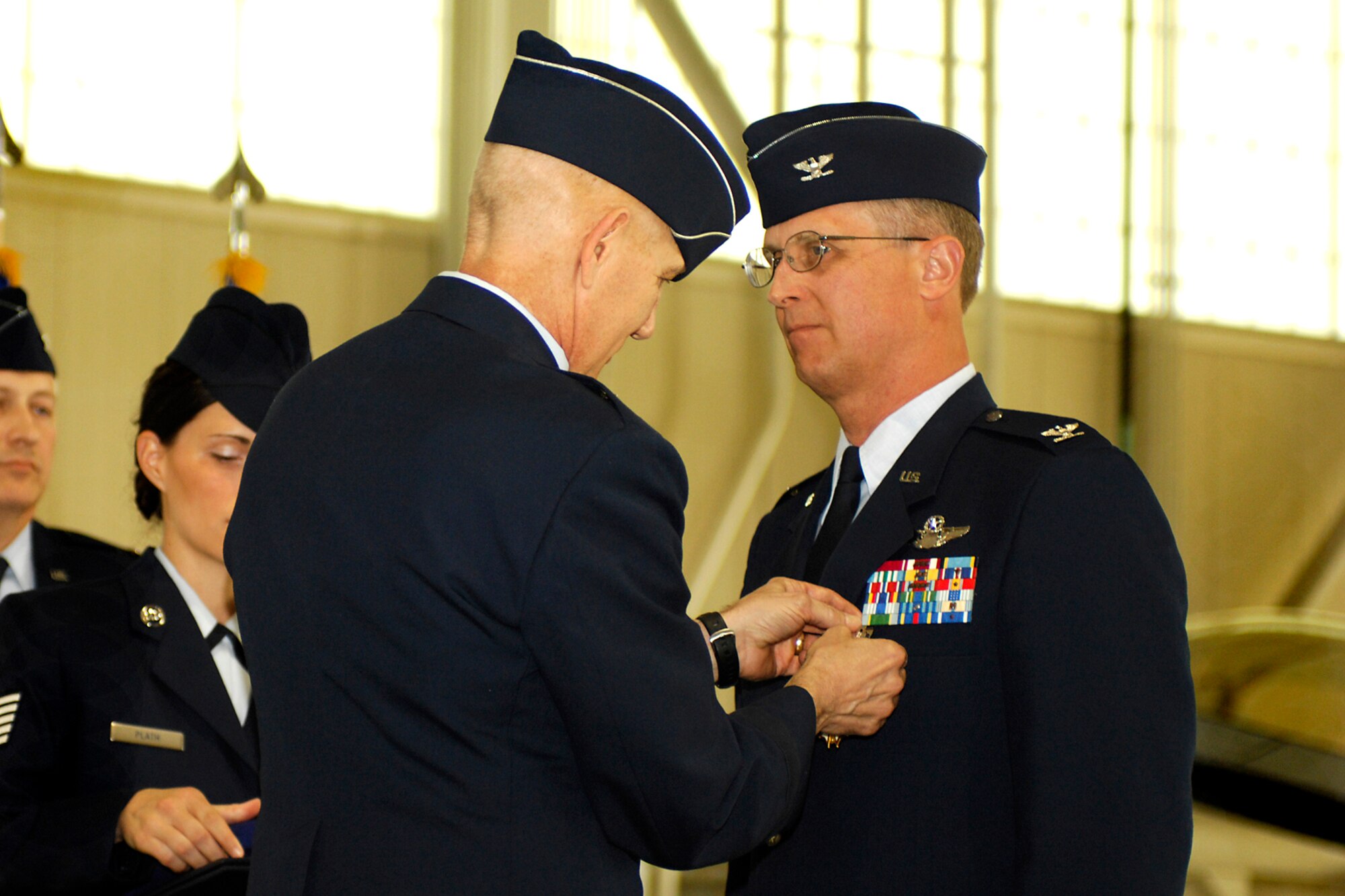 LANGLEY AIR FORCE BASE, Va. -- Brig. Gen. William Busby III , Assistant Adjutant General for Air, Headquarters, Virginia Air National Guard, awards Col. Jay Pearsall, the previous 192nd Fighter Wing commander, the Legion of Merit, first oak leaf cluster, during the 192nd FW change of command here May 17.  (U.S. Air Force photo/Airman Gul Crockett)