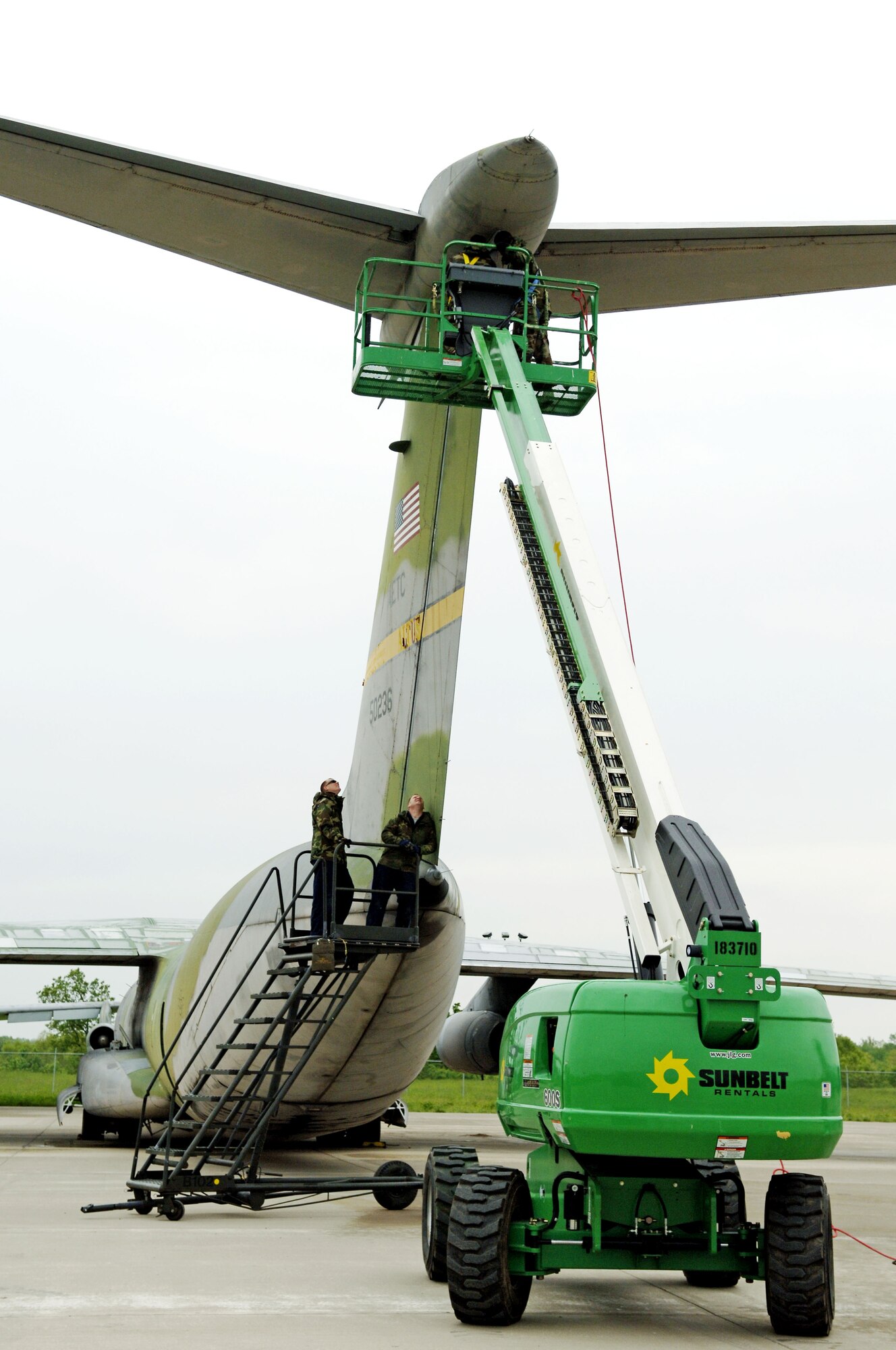 SCOTT AIR FORCE BASE, Ill. -- Crew chiefs and structural maintainers from the 653rd Combat Logistics Support Squadron at Robins Air Force Base, Ga., lock out the rudder on a C-141 Starlifter aircraft at MidAmerica airport, close to Scott Air Force Base, Ill.  This aircraft is one of five that will be on permanent display as part of the Scott Field Heritage Airpark. (U.S. Air Force photo/Tech. Sgt. Tony Tolley)