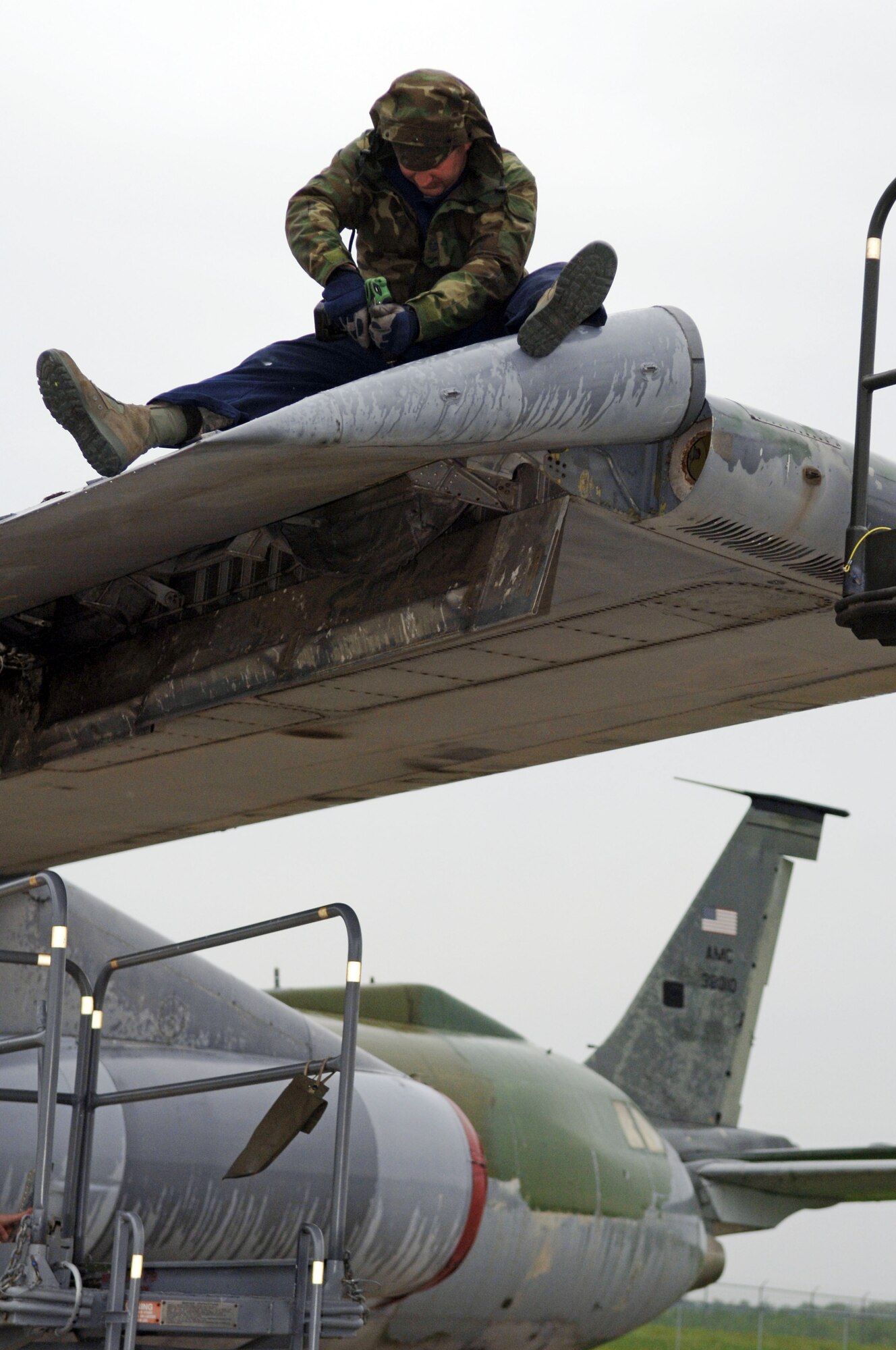 SCOTT AIR FORCE BASE, Ill. -- Tech. Sgt. Amos Salisbury, crew chief from the 653rd Combat Logistics Support Squadron at Robins Air Force Base, Ga., replaces aileron panels on a C-141 Starlifter aircraft at MidAmerica airport, close to Scott Air Force Base, Ill.  This aircraft is one of five that will be on permanent display as part of the Scott Field Heritage Airpark. (U.S. Air Force photo/Tech. Sgt. Tony Tolley)