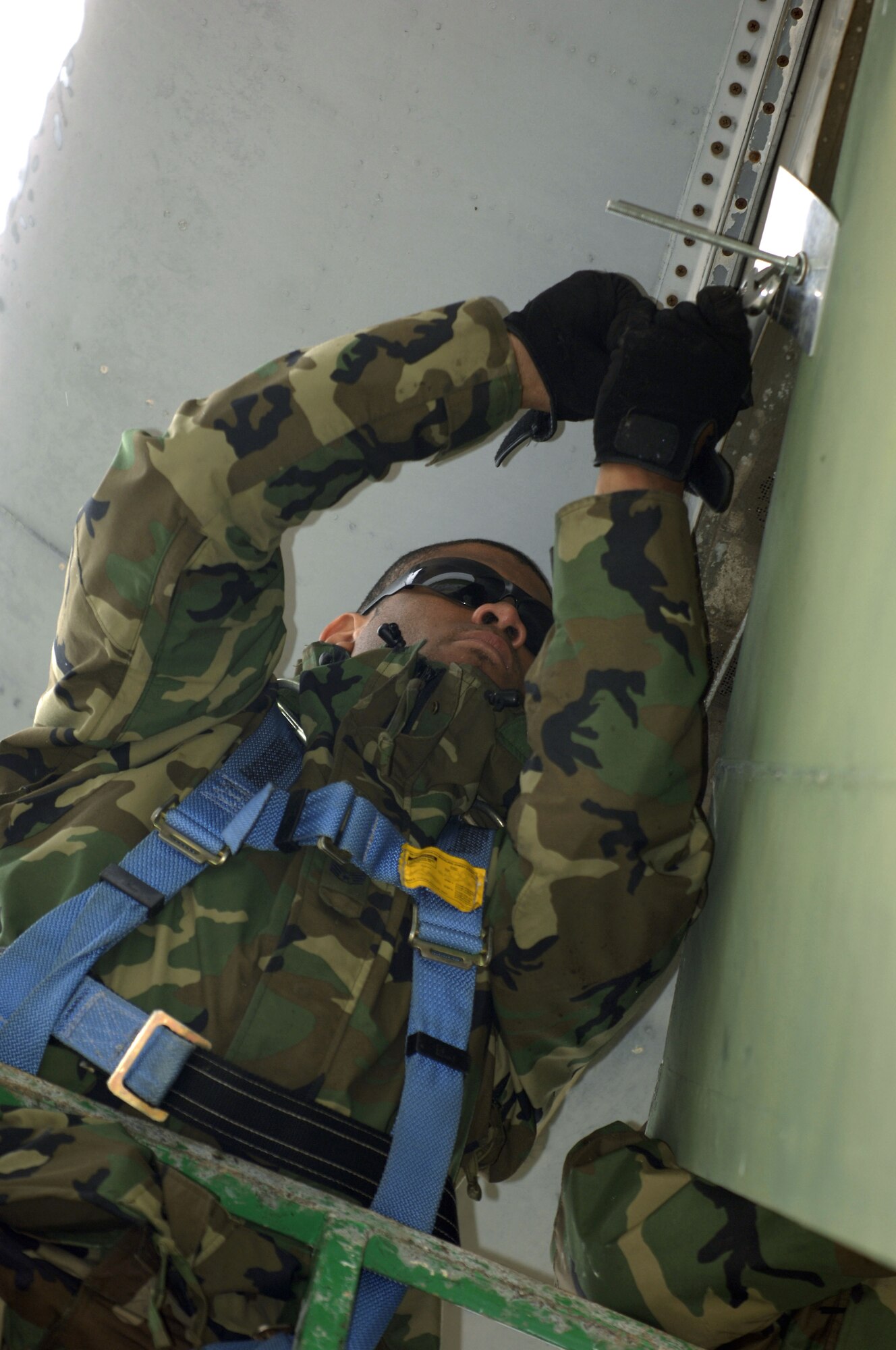 SCOTT AIR FORCE BASE, Ill. -- Staff Sgt. John Johnson, structural maintenance from the 653rd Combat Logistics Support Squadron at Robins Air Force Base, Ga., locks out the rudder on a C-141 Starlifter aircraft at MidAmerica airport, close to Scott Air Force Base, Ill. This aircraft is one of five that will be on permanent display as part of the Scott Field Heritage Airpark. (U.S. Air Force photo/Tech. Sgt. Tony Tolley)