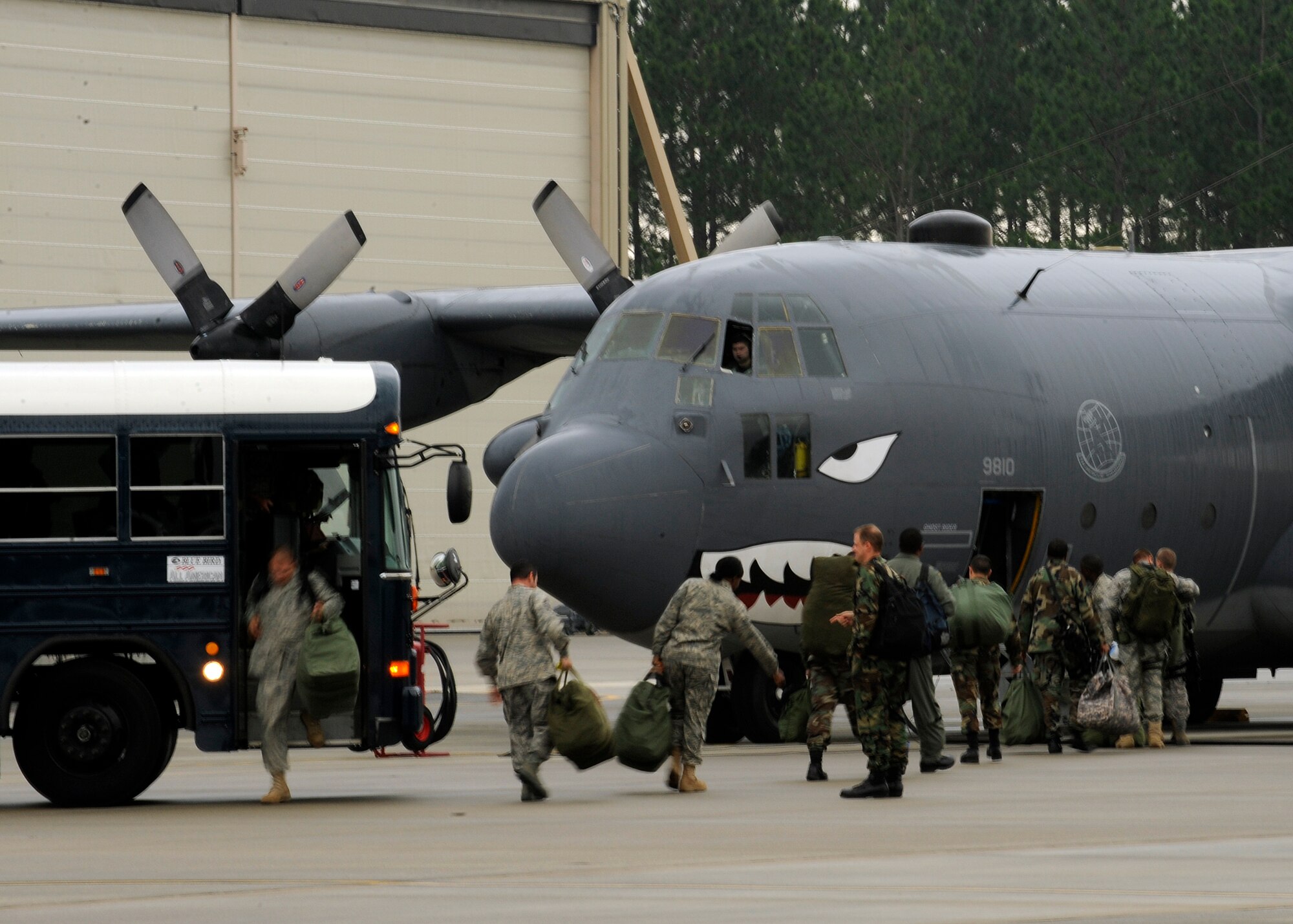 MOODY AIR FORCE BASE, Ga. -- Simulated deployers, from the 23rd Wing, board a HC-130P King with their mobility bags during a hurricane evacuation exercise here May 21. The exercise prepares Airmen for real-world humanitarian efforts. (U.S. Air Force photo by Airman 1st Class Brittany Barker)
