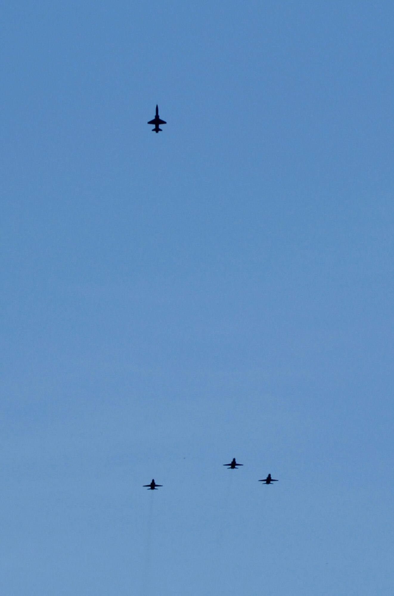 SEDALIA, Mo., - Four T-38s from Whiteman AFB perform a missing man flyover in honor of 2nd Lt. George A. Whiteman May 17 during the 20th Annual Whiteman Memorial Wreath Laying Ceremony in Sedalia's Memorial Park Cemetery. The ceremony honored 2nd Lt. George A. Whiteman, a Sedalia native and the first American air casualty of World War II. Lieutenant Whiteman's P-40 fighter, "Lucky Me," was shot down as he took off during the Japanese attack on Pearl Harbor Dec. 7, 1941. (U.S. Air Force/1st Lt. Matthew Miller)

