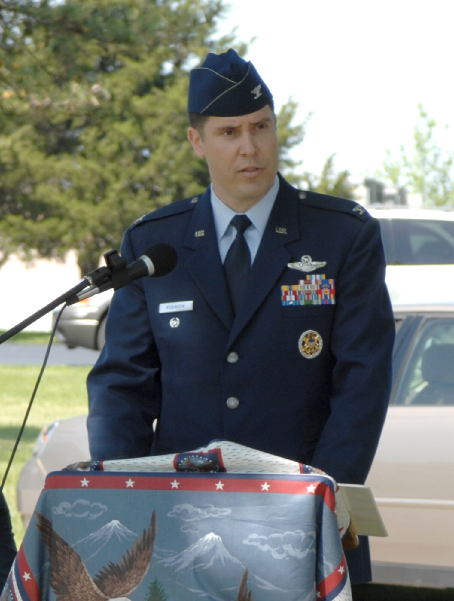 SEDALIA, Mo., - Col. John W. Robinson Jr., 509th Bomb Wing vice commander, speaks to nearly 100 Sedalia residents, George Whiteman relatives and base members during the 20th Annual Whiteman Memorial Wreath Laying Ceremony in Sedalia's Memorial Park Cemetery. (U.S. Air Force/1st Lt. Matthew Miller)