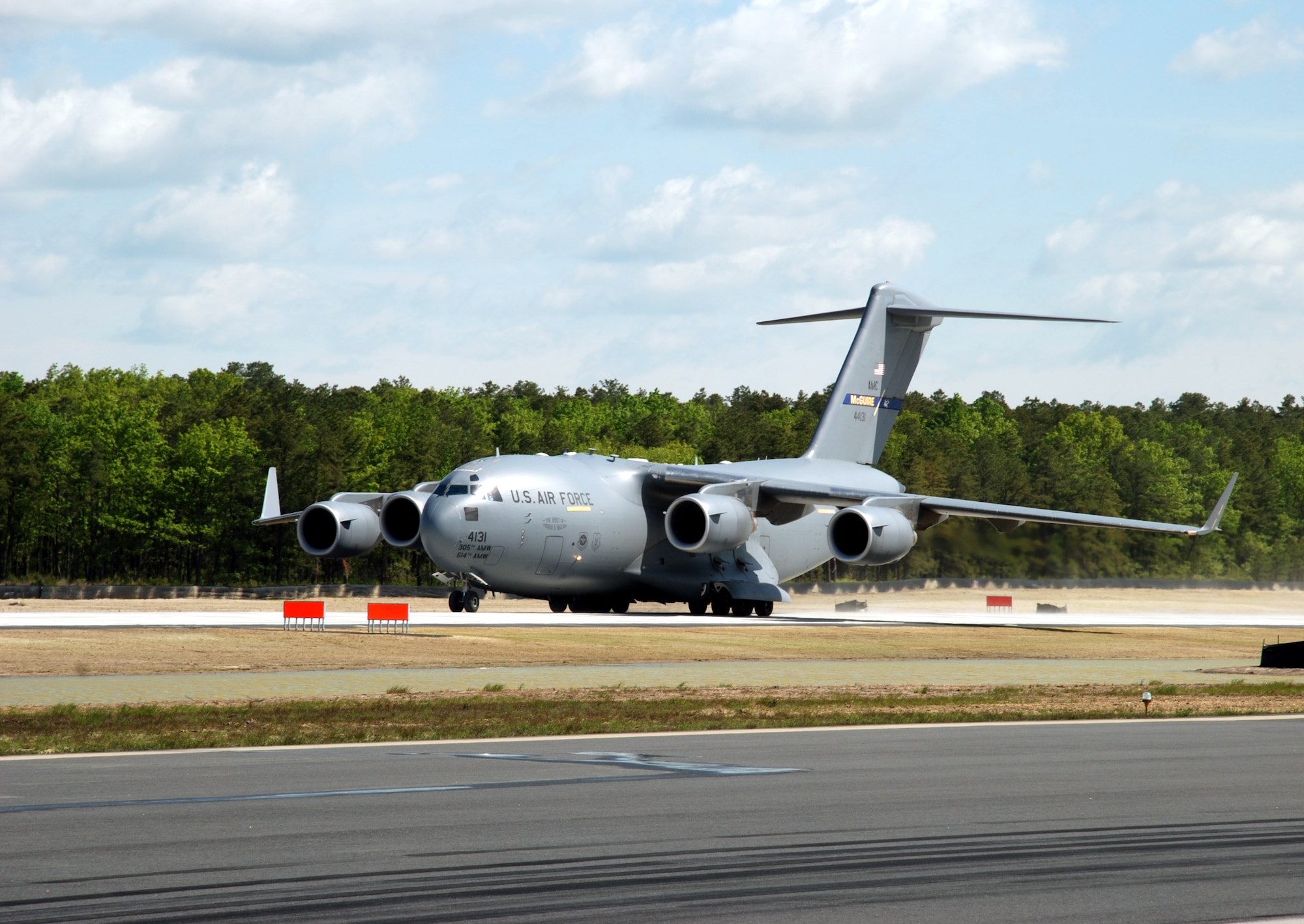 Col. Balan Ayyar, 305th Air Mobility Wing commander, lands on the new C-17 Northeast Landing Zone at Lakehurst Naval Air Engineering Station May 19. Colonel Ayyar was first to land an aircraft on the area; a ribbon cutting followed the landing. (U.S. Air Force photo/Capt. Tony Duggan)  