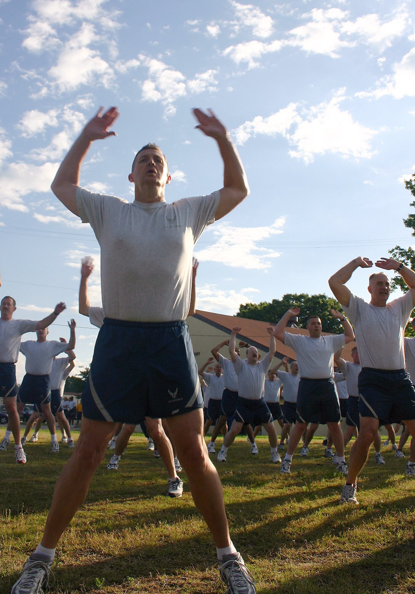Chief Master Sgt. John Harrison (left) counts out loud as he performs jumping jacks with his peers during the first event of the Senior Enlisted Leader Summit May 18 at Maxwell Air Force Base's Gunter Annex in Alabama. More than 350 command chief master sergeants, career field managers, professional military education commandants and other key senior enlisted leaders kicked off the 2008 Senior Enlisted Leader Summit with a 2.2-mile formation run at Maxwell's Gunter Annex. Chief Harrison is assigned to the Air Force Inspection Agency at Kirtland Air Force Base, N.M. (U.S. Air Force photo/Staff Sgt. Jason Lake) 
