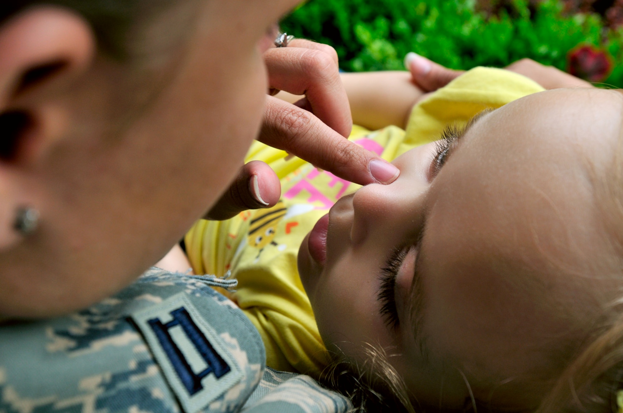 SCOTT AIR FORCE BASE, Ill. -- Capt. Kerri Rochman, 375th Mission Support Squadron chief of career development, spends some quiet time on the porch with her 3 1/2 year old daughter Elise on May 19. Elise was diagnosed more than two years ago with Tays-Sachs disease, an inherited incurable disease of the central nervous system. (U.S. Air Force photo/Master Sgt. Maurice Hessel)