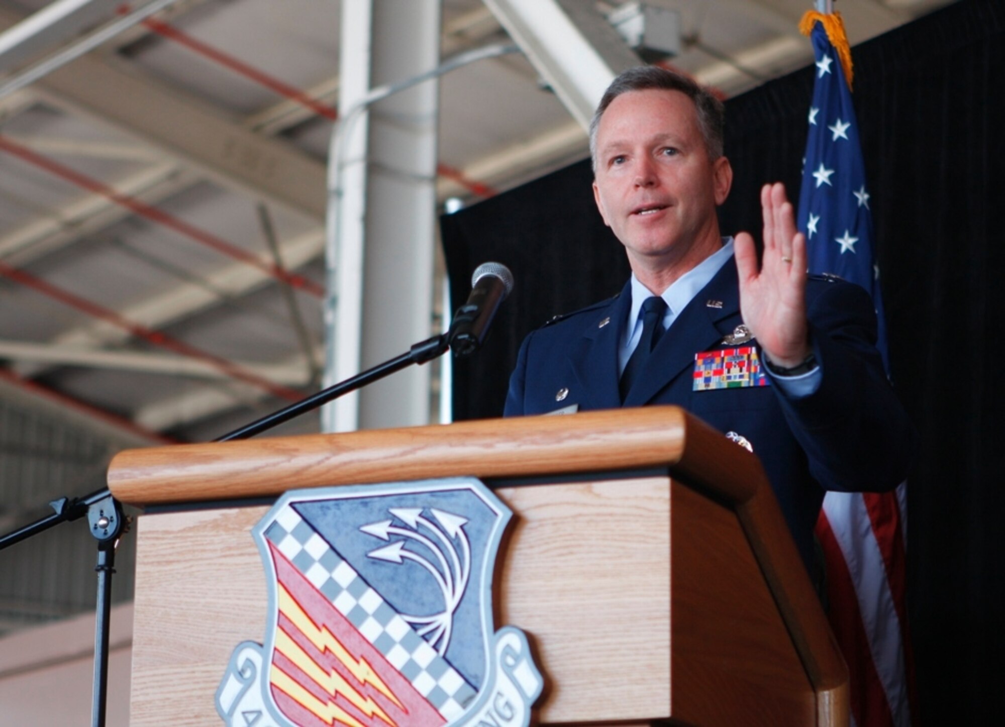 Col. William B. Binger speaks to members of the 482nd Fighter Wing, family, and Air Force leaders immediately after assuming command of the wing during a change of command ceremony on May 18. Colonel Binger’s previous assignment was Deputy Director of Air Force Strategic Planning and Deputy Chief of Staff for Strategic Plans and Programs at Headquarters USAF. He is also a command pilot with more than 4,400 hours in the F-16, including 40 combat missions over Iraq. (Courtesy photo by Albert Siegel)