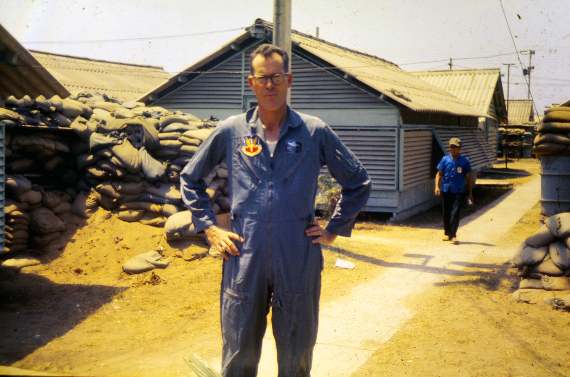 Maj. Robert F. Woods had this photo taken of him while he was stationed at Da Nang Air Base, Vietnam, in 1968.  On June 26, 1968, Major Woods disappeared in the Quang Binh Province in Vietnam after the 02-A Skymaster he was flying crashed in a remote mountainous region.  A native of Salt Lake City, Utah, Major Woods was in the military for 20 years when he disappeared. His career began in June 1948 as an enlisted aircrew member on a C-74 Globemaster in the Berlin Airlift.  In 1951 he became an officer and a pilot flying KC-97 Stratotankers in the Korean Conflict.  In Vietnam, he served as a forward air controller in the Skymaster with the 20th Tactical Air Support Squadron at DaNang AB. He earned his first of eight Air Medals in Korea and also earned the Distinguished Flying Cross and Bronze Star for his service in Vietnam.  On April 9, 2008, he was laid to rest at Arlington National Cemetery nearly 40 years after he disappeared.  (Photo courtesy of the Woods family)  