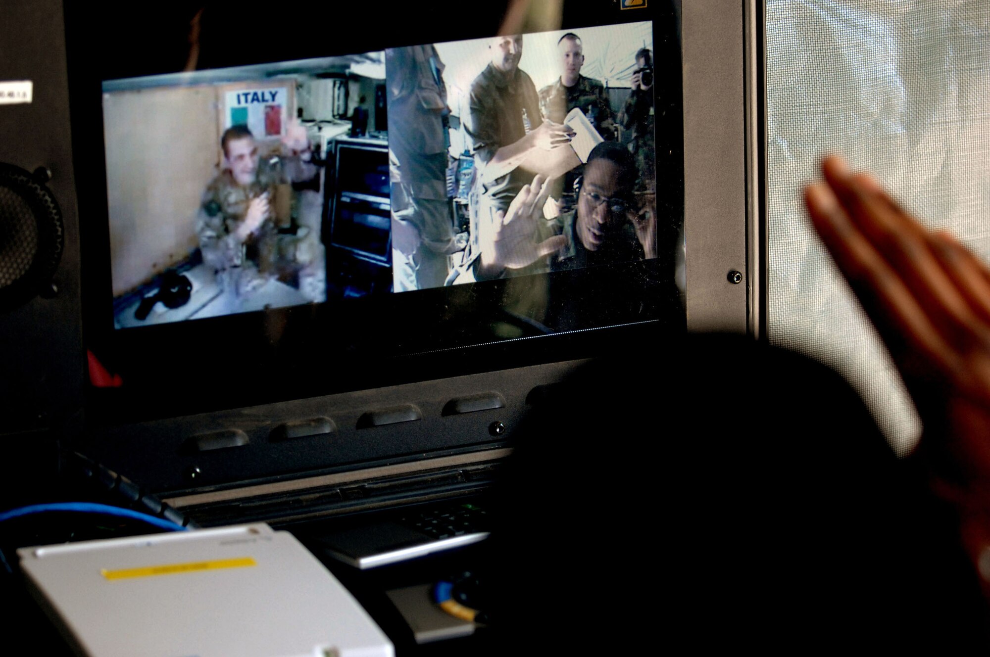 Senior Airman Kevin Craig, 1st CBCS communications access package journeyman, talks with Italian Army Sgt. Giovanni Caltabiano, transmissions specialist, during a video teleconference check as part of Combined Endeavor 2008. 40 participating nations use CE 08 to plan, prepare and practice using a full range of communications equipment, policies and procedures prior to deploying for NATO missions and emerging, real-world crisis situations such as the evacuation of Lebanon and response to natural disasters. (U.S. EUCOM photo by U.S. Air Force Airman 1st Class Nathan Lipscomb) (RELEASED)