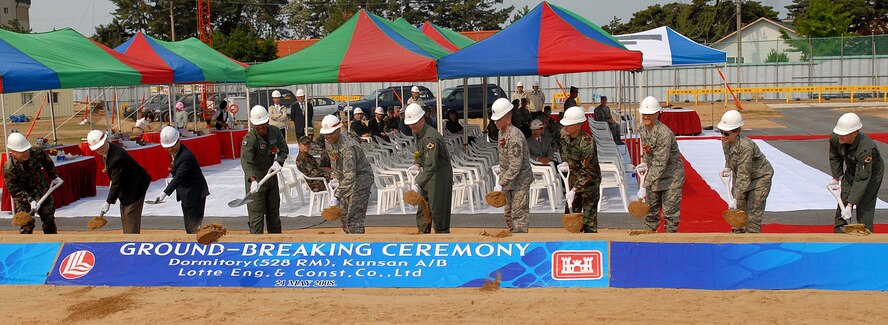 KUNSAN AIR BASE, Republic of Korea -- Base officials and Army Corps of Engineers
assigned here team with a local construction company participate in the ground breaking ceremony of a “Dorms-4-Airmen” project here May 21. The dorm is scheduled to be completed in September 2010. The project is part of the Air Force's initiative to improve the quality of life for Airmen. (U.S. Air Force photo/Senior Airman Giang Nguyen)