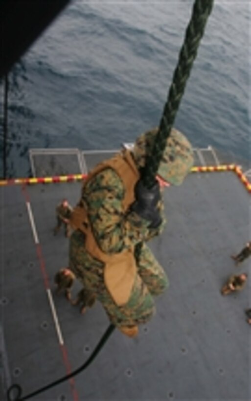 U.S. Marines with the 31st Marine Expeditionary Unit participate in a fast rope exercise moving out the back of a CH-46E Sea Knight helicopter and onto the flight deck of the USS Essex (LHD 2) on May 18, 2008.  