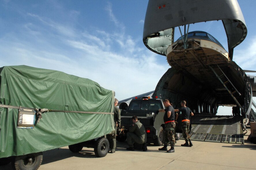 SHAW AIR FORCE BASE, S.C. -- Airmen from the 20th Logistics Readiness Squadron and 337th Airlift Squadron load cargo on a C-5 Galaxy for Airmen set to deploy May 22. More than 200 Airmen from the 20th Fighter Wing are deploying to Southwest Asia to support the Global War on Terrorism. (U.S. Air Force photo/Airman 1st Class Matthew Davis)