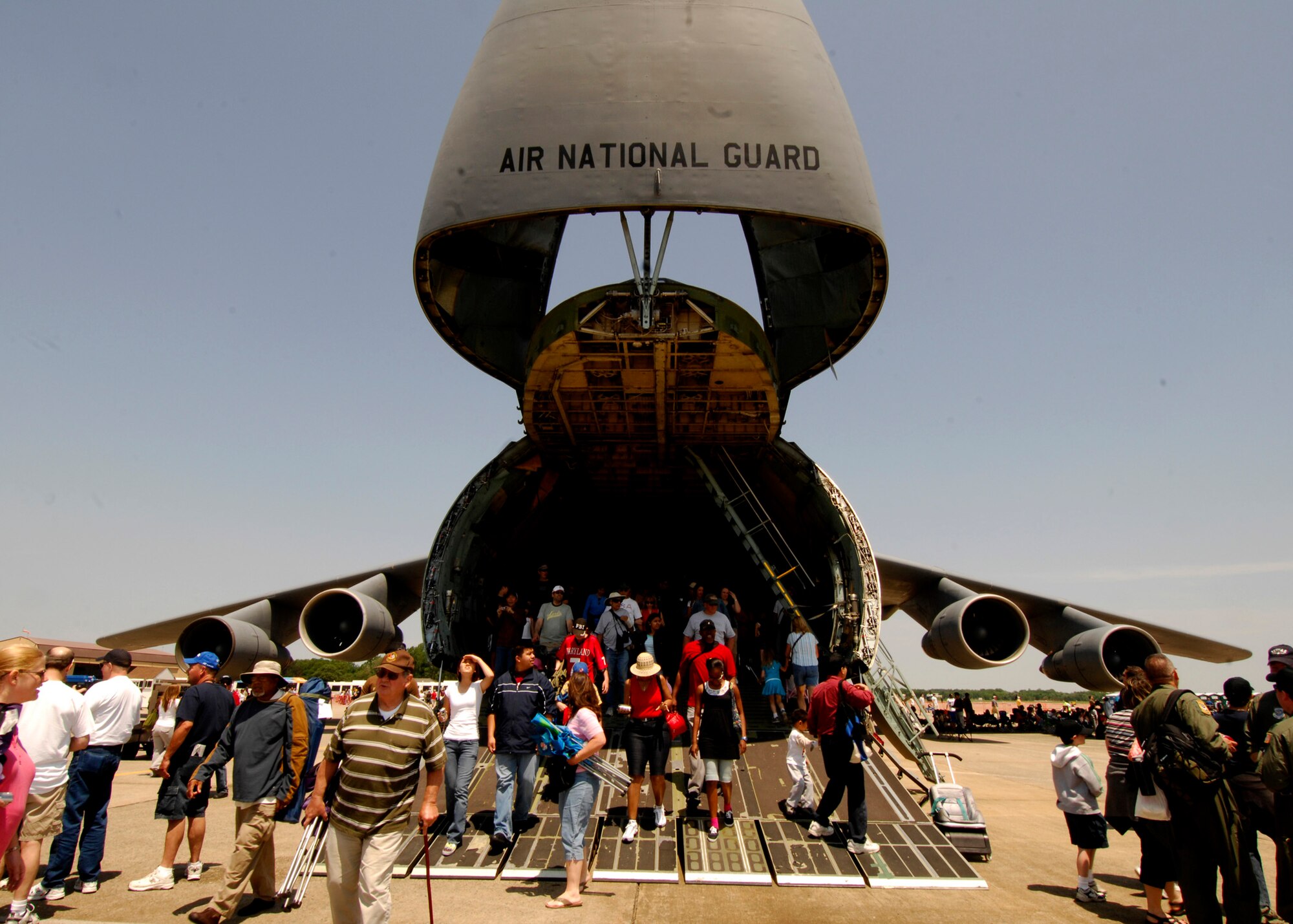 A crowd walks through the C-5 Galaxy at the 2008 Joint Service Open House hosted by Andrews Air Force Base, Md., May 17th.   This year?s event will have demonstrations by the Navy Blue Angels and the Army's Golden Knights.  Once again the JSOH will host a wide variety of both military and civilian air and ground demonstrations. To include the Air Force's newest and the world's most advanced fighter jet, the F-22A Raptor. (U.S. Air Force photo by Tech Sgt. Suzanne M. Day)
