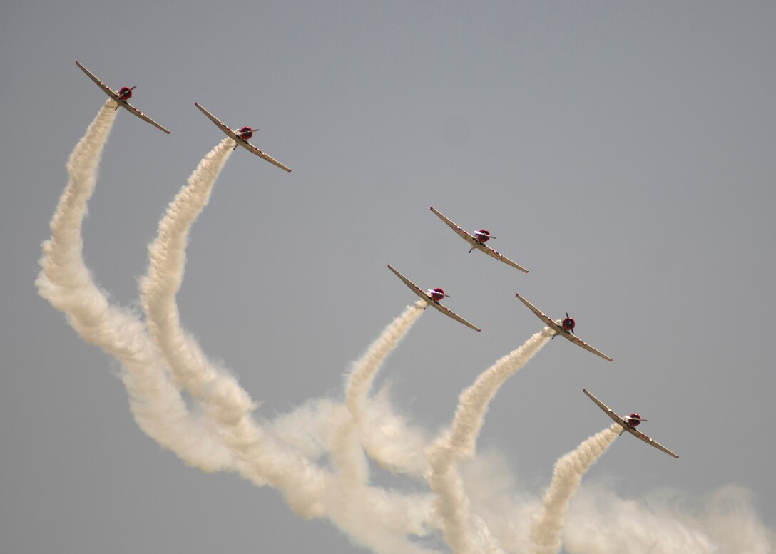 T-6 Texans fly in formation at the 2008 Joint Service Open House hosted by Andrews Air Force Base, Md., on May 17th.   This year?s event will have demonstrations by the Navy Blue Angels and the Army's Golden Knights.  Once again the JSOH will host a wide variety of both military and civilian air and ground demonstrations. To include the Air Force's newest and the world's most advanced fighter jet, the F-22A Raptor. (U.S. Air Force photo by Tech Sgt. Suzanne M. Day)(Released)
