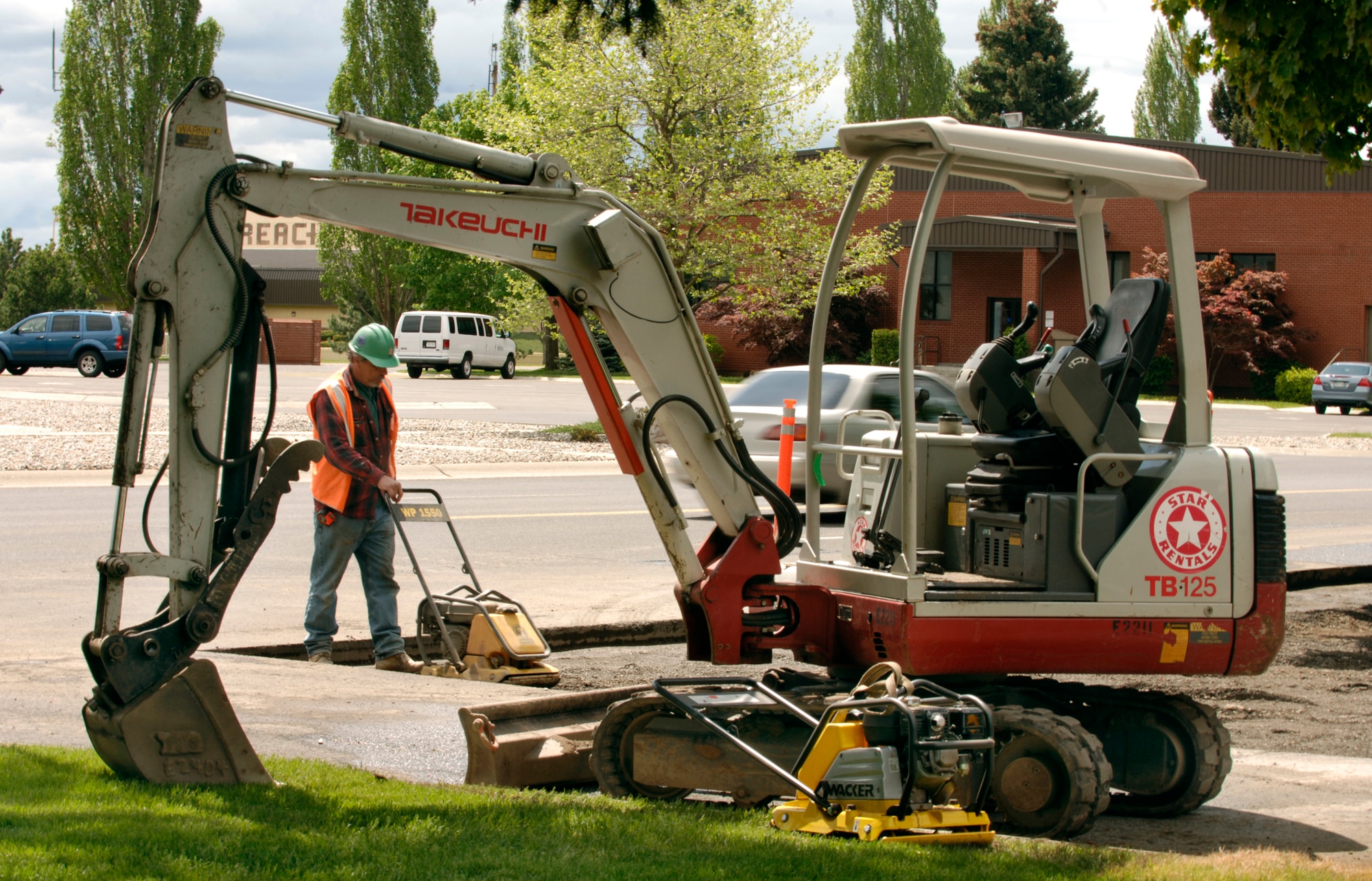 FAIRCHILD AIR FORCE BASE, Wash. – A construction worker compacts loose dirt in preparation for laying cement at the Wing Headquarters front entryway here May 21. The new entryway will restrict automobiles from unauthorized entry. (U.S. Air Force photo / Airman 1st Class Joshua Chapman) 