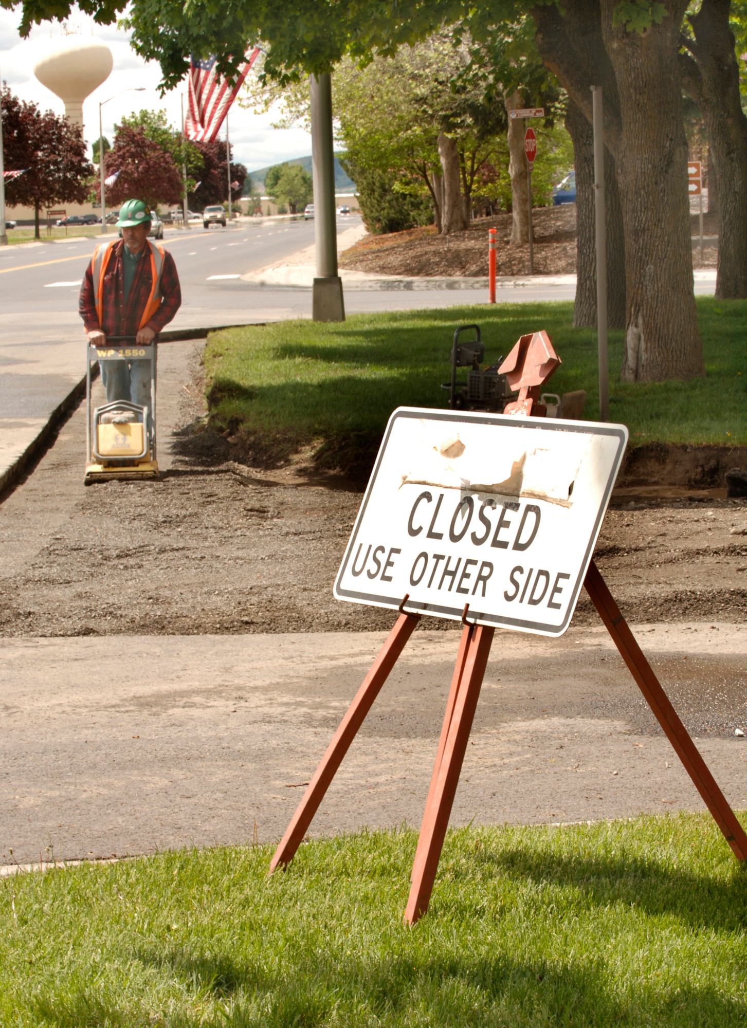 FAIRCHILD AIR FORCE BASE, Wash. – A construction worker compacts loose dirt in preparation for laying cement at the Wing Headquarters front entryway here May 21. The new entryway will restrict automobiles from unauthorized entry. (U.S. Air Force photo / Airman 1st Class Joshua Chapman) 