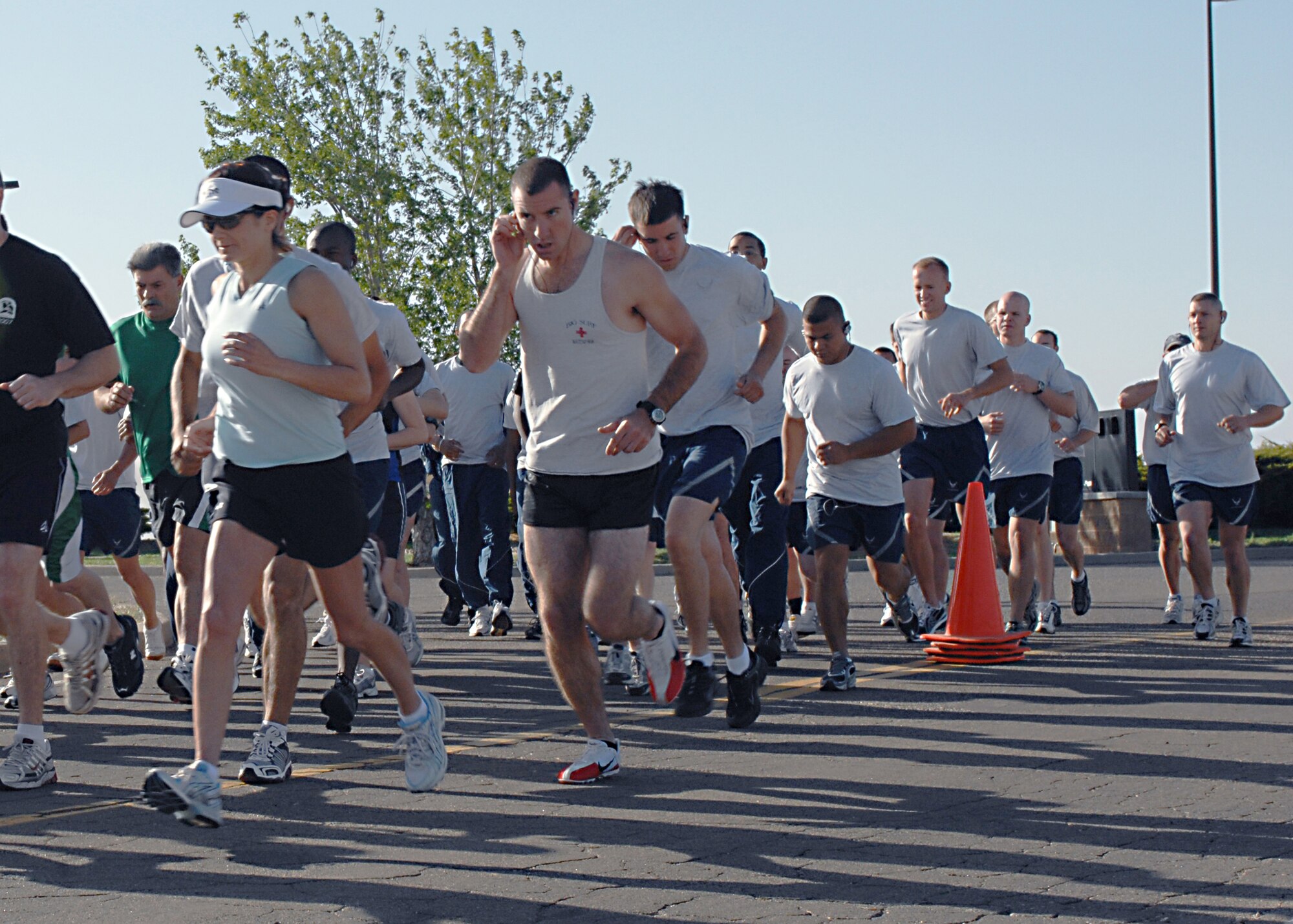 CANNON AIR FORCE BASE N.M. -- 27th Special Operations Wing Airmen dedicate their annual 5.5-mile Gate-to-Gate Run on May 22 as part of Memorial Day observances. Participants picked up flowers at the halway point and placed them at the Bataan Death March Memorial on their way to the finish line. (U.S. Air Force photo by Aiman 1st Class James R. Bell)