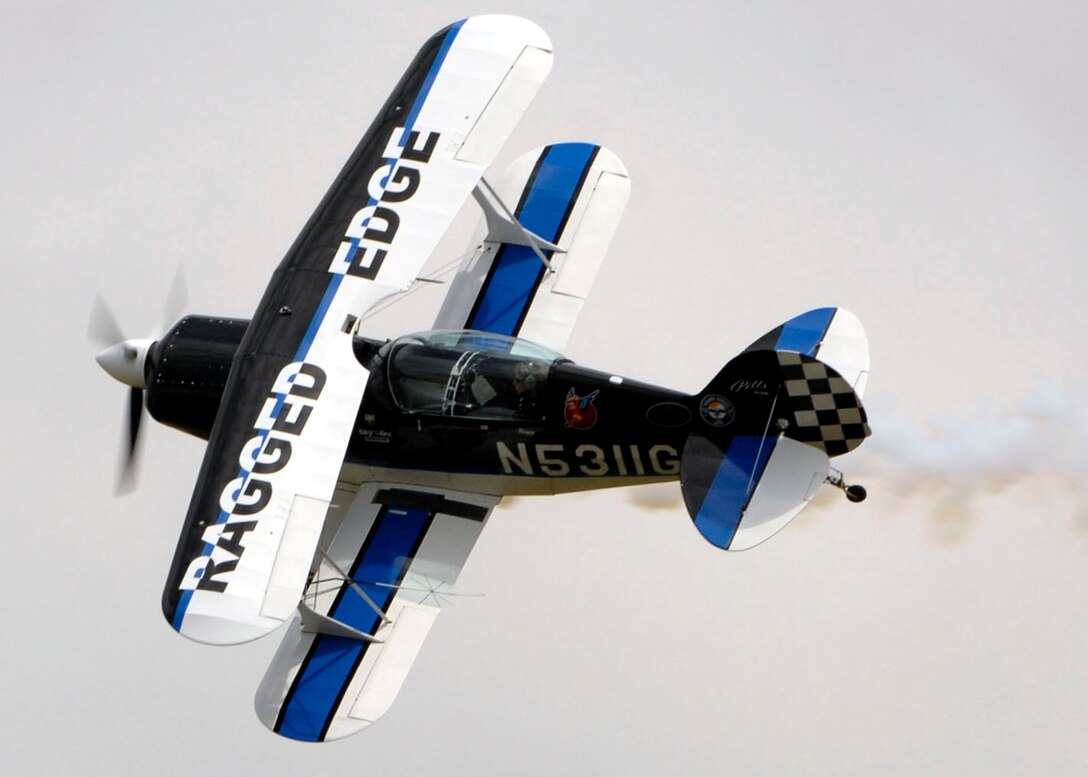 Jill ?Raggz? Long performs in her Pitts S2B acrobatic bi-plane over Andrews Air Force Base during its annual Joint Service Open House May 17.  The 2008 JSOH commemorated the 60th Anniversary of the Berlin Airlift and showcased the Navy Blue Angels, the Army's Golden Knights and a wide variety of both military and civilian air and ground demonstrations. (U.S. Air Force photo/Senior Airman Steven R. Doty)