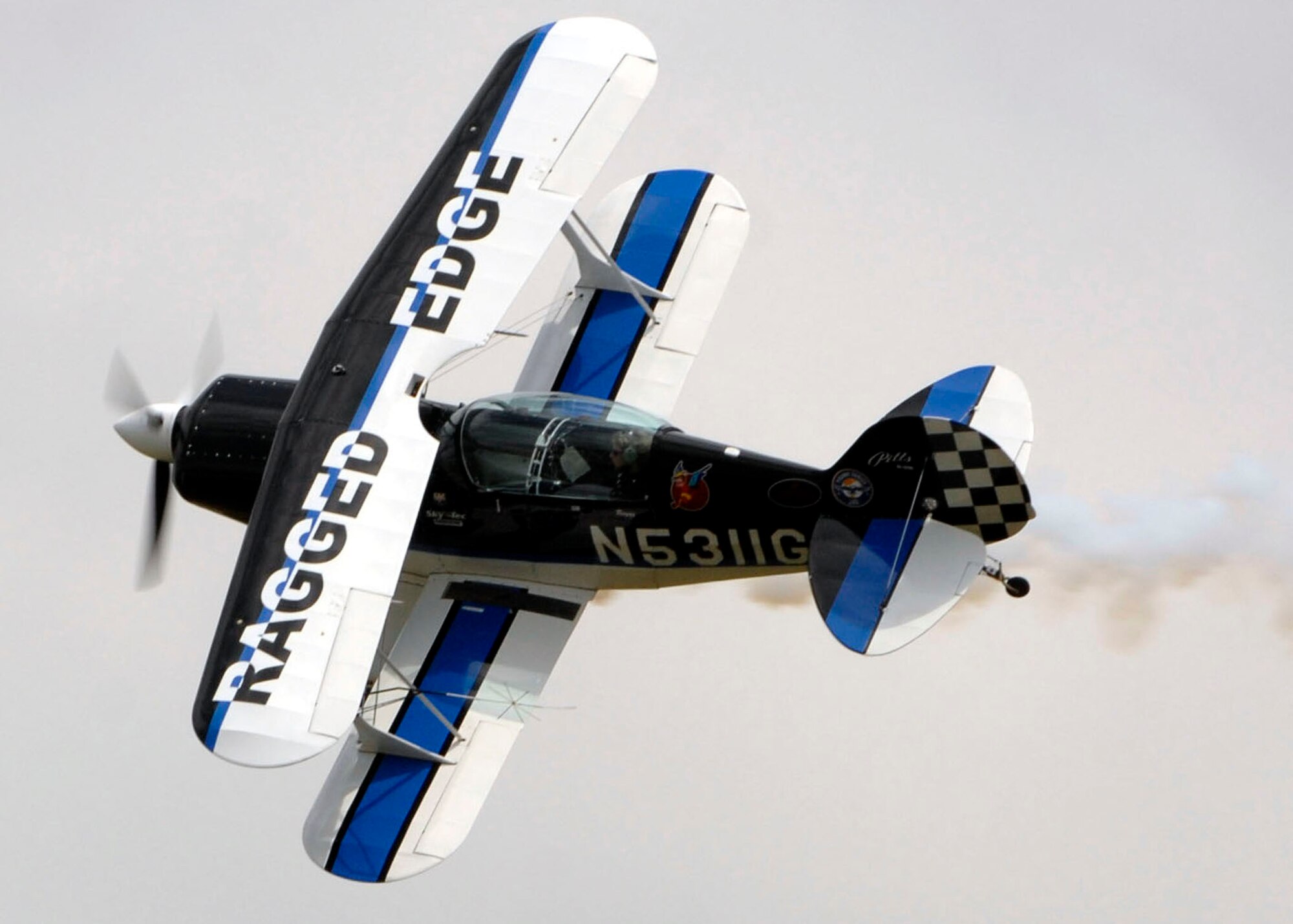 Jill ?Raggz? Long performs in her Pitts S2B acrobatic bi-plane over Andrews Air Force Base during its annual Joint Service Open House May 17.  The 2008 JSOH commemorated the 60th Anniversary of the Berlin Airlift and showcased the Navy Blue Angels, the Army's Golden Knights and a wide variety of both military and civilian air and ground demonstrations. (U.S. Air Force photo/Senior Airman Steven R. Doty)