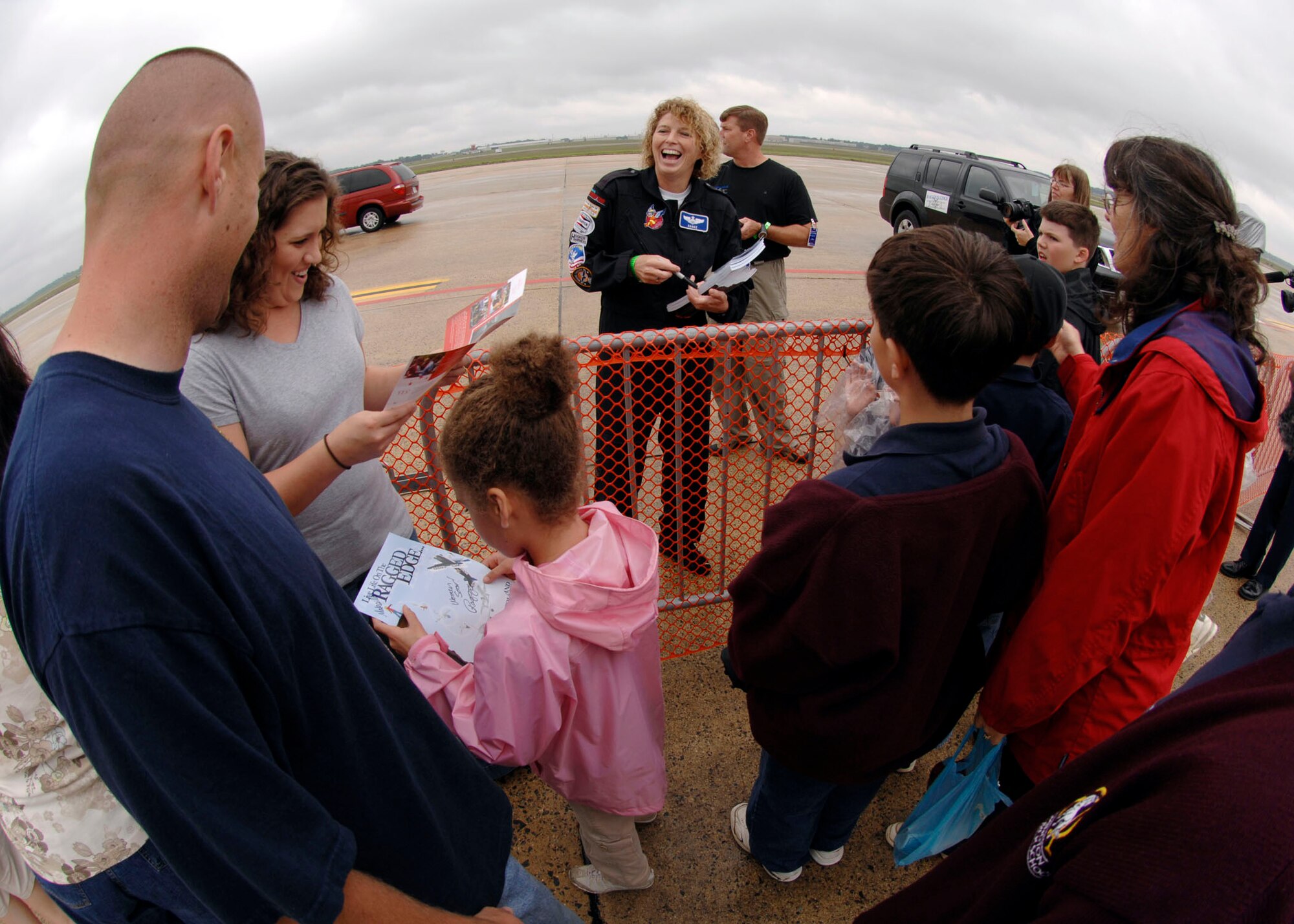Jill ?Raggz? Long signs autograph?s and shares a moment with fans after a performance at Andrews Air Force Base during its annual Joint Service Open House May 17.  The 2008 JSOH commemorated the 60th Anniversary of the Berlin Airlift and showcased the Navy Blue Angels, the Army's Golden Knights and a wide variety of both military and civilian air and ground demonstrations. (U.S. Air Force photo by Senior Airman Steven R. Doty)