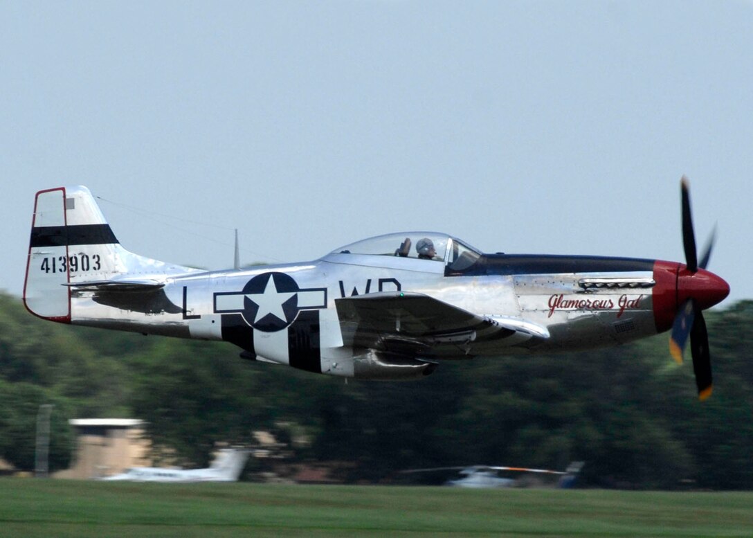 A P-51 Mustang makes a high speed pass at Andrews Air Force Base during its annual Joint Service Open House May 17.  The 2008 JSOH commemorated the 60th Anniversary of the Berlin Airlift and showcased the Navy Blue Angels, the Army's Golden Knights and a wide variety of both military and civilian air and ground demonstrations. (U.S. Air Force photo/Senior Airman Steven R. Doty)