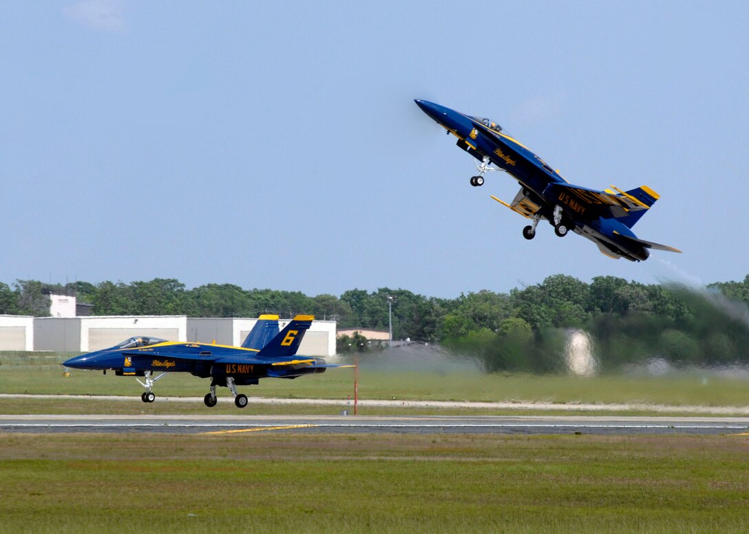 Two F/A-18 Hornets from the U.S. Navy?s Flight Demonstration Squadron, the ?Blue Angels?, take off in preparation for their show at Andrews Air Force Base during its annual Joint Service Open House May 17.  The 2008 JSOH commemorated the 60th Anniversary of the Berlin Airlift and showcased the Navy Blue Angels, the Army's Golden Knights and a wide variety of both military and civilian air and ground demonstrations. (U.S. Air Force photo/Senior Airman Steven R. Doty)