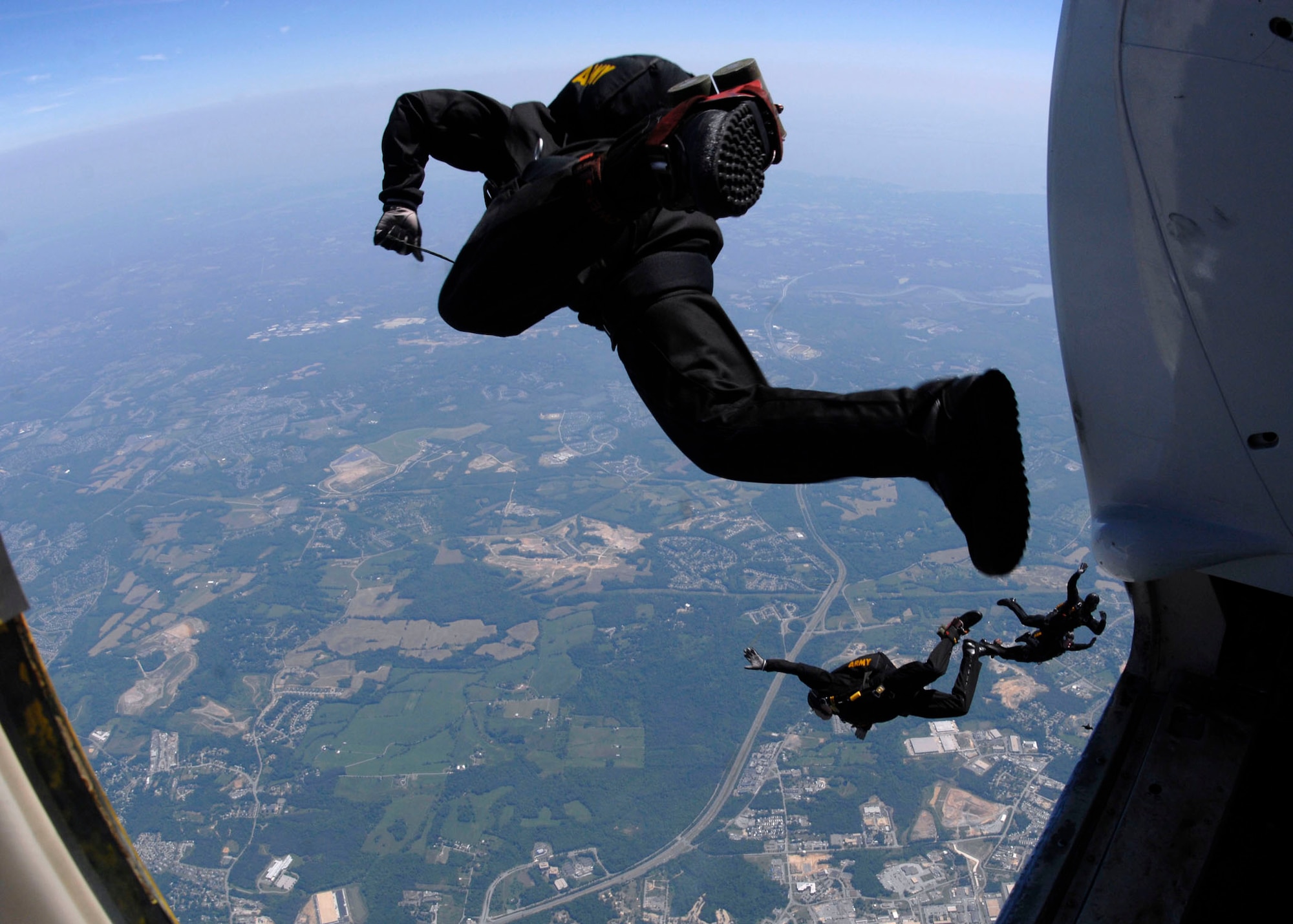 Members of the U.S. Army parachute team, ?Golden Knights?, jump over the annual Joint Service Open House held at Andrews Air Force Base May 17.  The 2008 JSOH commemorated the 60th Anniversary of the Berlin Airlift and showcased the Navy Blue Angels, the Army's Golden Knights and a wide variety of both military and civilian air and ground demonstrations. (U.S. Air Force photo/Senior Airman Steven R. Doty)