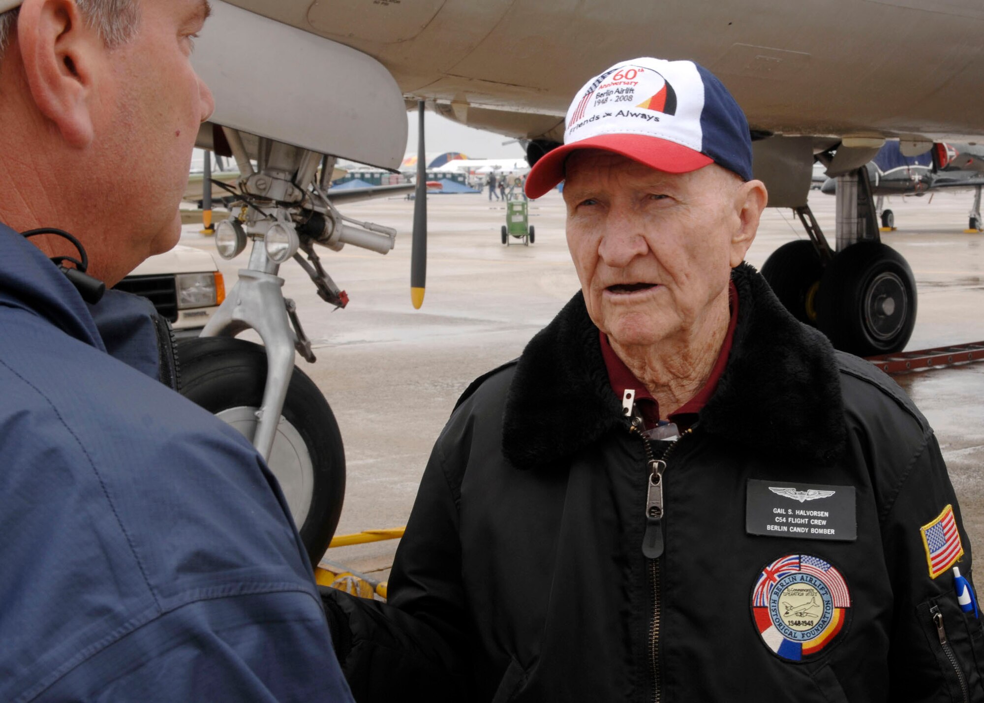 U.S. Air Force Retired Col. Gail Halvorson, known as the ?Candy Bomber? of the Berlin airlift, speaks with visitors at Andrews Air Force Base during its annual Joint Service Open House May 16.  The 2008 JSOH commemorated the 60th Anniversary of the Berlin Airlift and showcased the Navy Blue Angels, the Army's Golden Knights and a wide variety of both military and civilian air and ground demonstrations. (U.S. Air Force photo/Senior Airman Steven R. Doty)