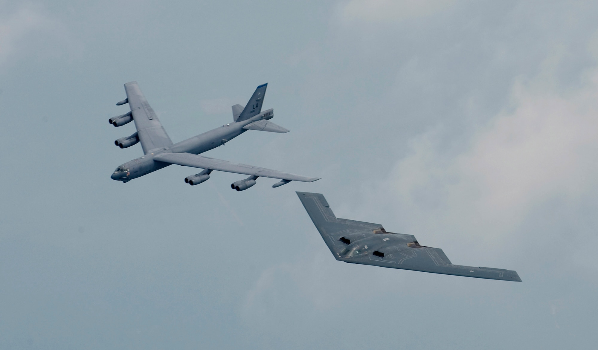 A B-2 Spirit and B-52 Stratofortress fly in formation over Shreveport, La., May 10 during the open house and air show at Barksdale Air Force Base, La. The air show featured modern day bombers, and commemorated the 75th anniversary of the base. (U.S. Air Force photo/Staff Sgt. Samuel Rogers)
