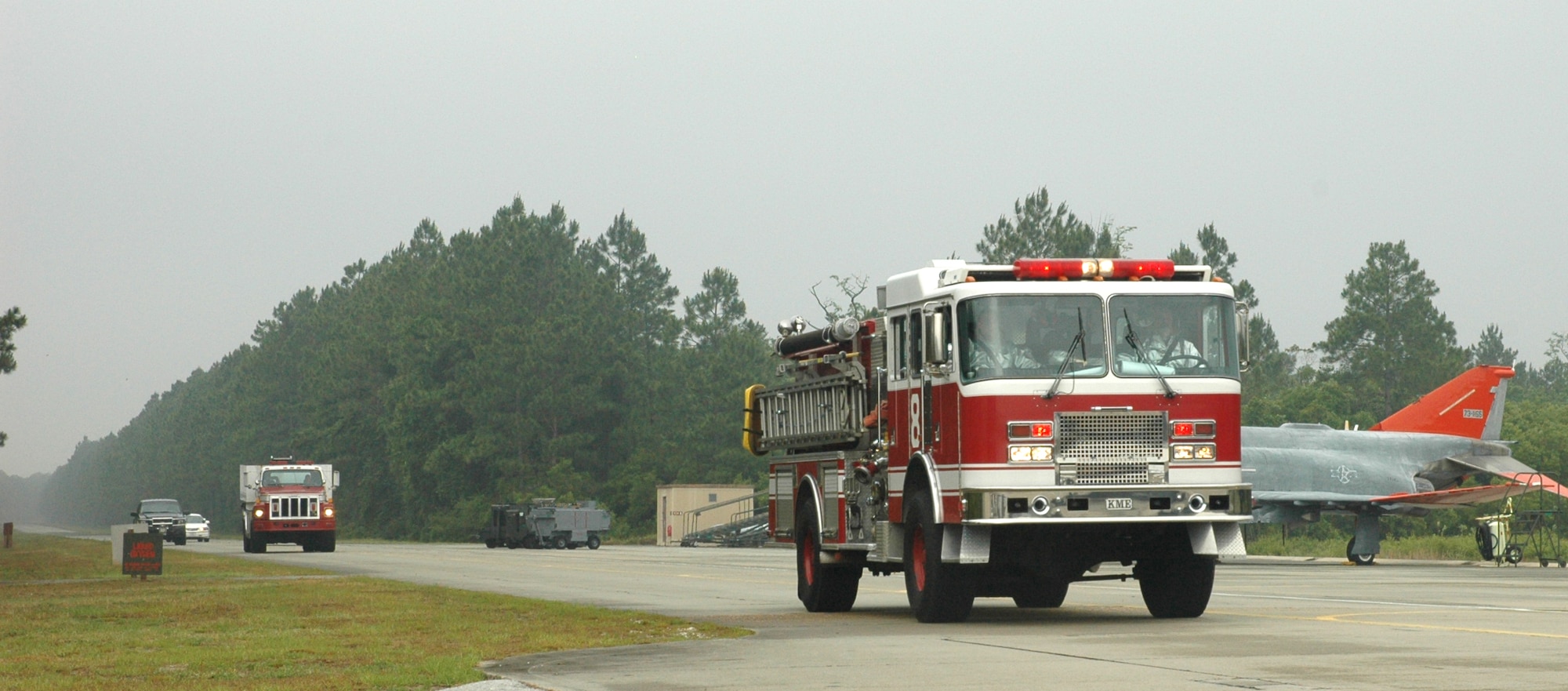 325th Fighter Wing emergency responding crews rush to the scene of the May 16 major accident response exercise.  (U.S. Air Force photo/Staff Sgt. Timothy R. Capling)