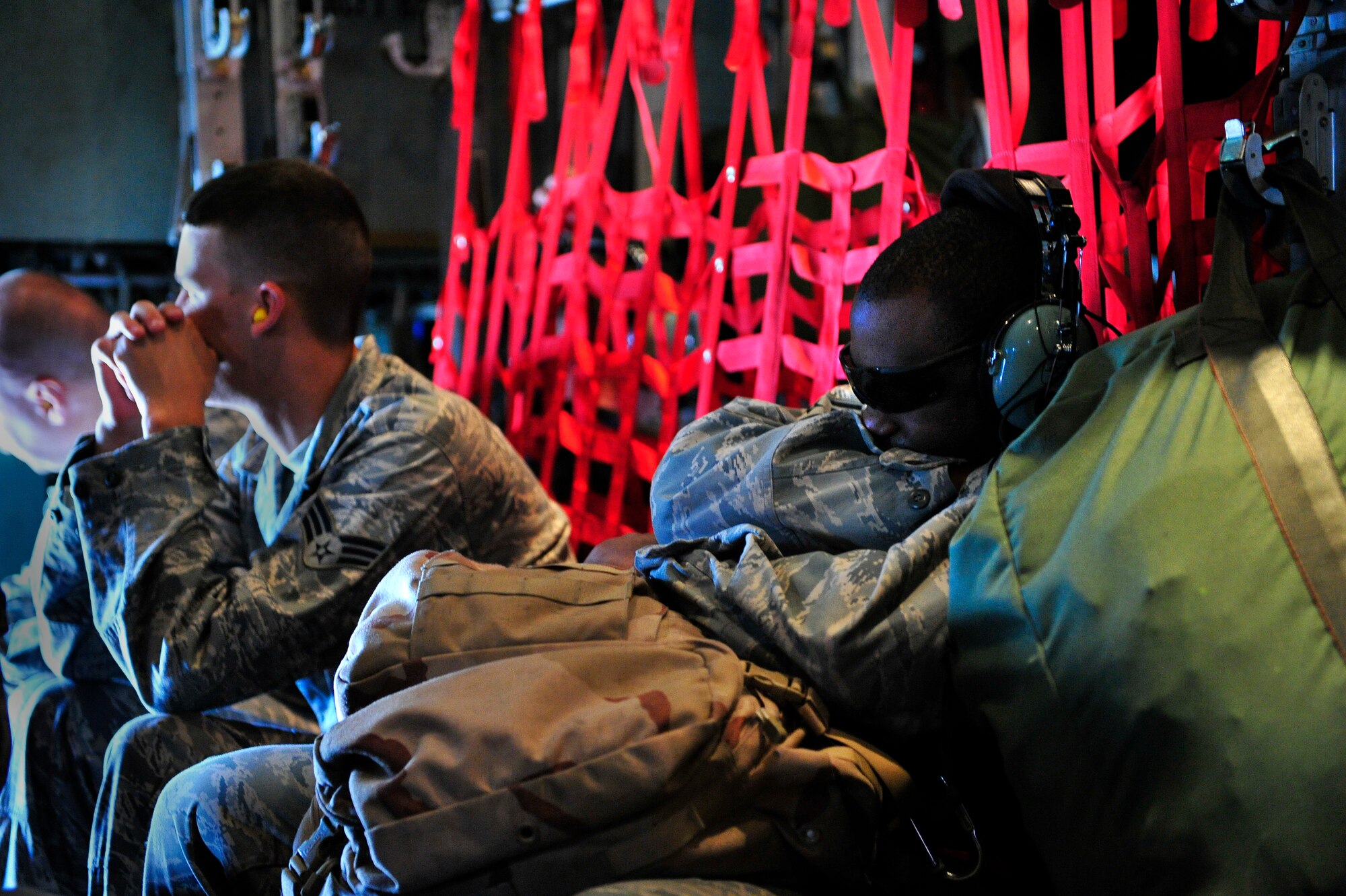 MOODY AIR FORCE BASE, Ga. -- Simulated deployers of the 23rd Wing catch some rest on a HC-130P King while waiting to depart during a hurricane evacuation exercise here May 21. The exercise helps Airmen plan accordingly if a real-world catastrophe were to occur. (U.S. Air Force photo by Senior Airman Elizabeth Rissmiller)