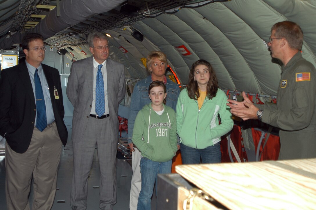 GRISSOM AIR RESERVE BASE, Ind., -- Chief Master Sgt. Tony Fansler, a KC-135R boom operator, shows a group from the Peru Mayor's Youth Leadership Council, the inner workings of a KC-135 Stratotanker.  The group toured Grissom May 22. From the left, are Peru Junior High school Assistant Principal Tim Conner, Peru Mayor James Walker and his assistant Lori Holderman, and students Maddy Eddy and Lauren Fields. (Air Force photo/Senior Airman Ben Mota)