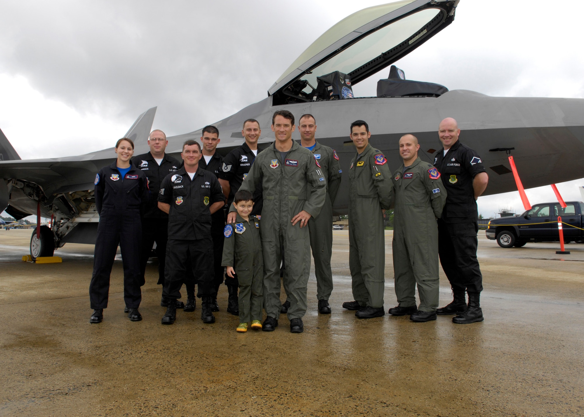 Maj Max Moga and his team pose for a group picture with Brandon Leach, the "Pilot for the Day" during the Joint Service Open House at Andrews Air Force Base, Md. (U.S. Air Force photo by Senior Airman Renae Kleckner)(released)