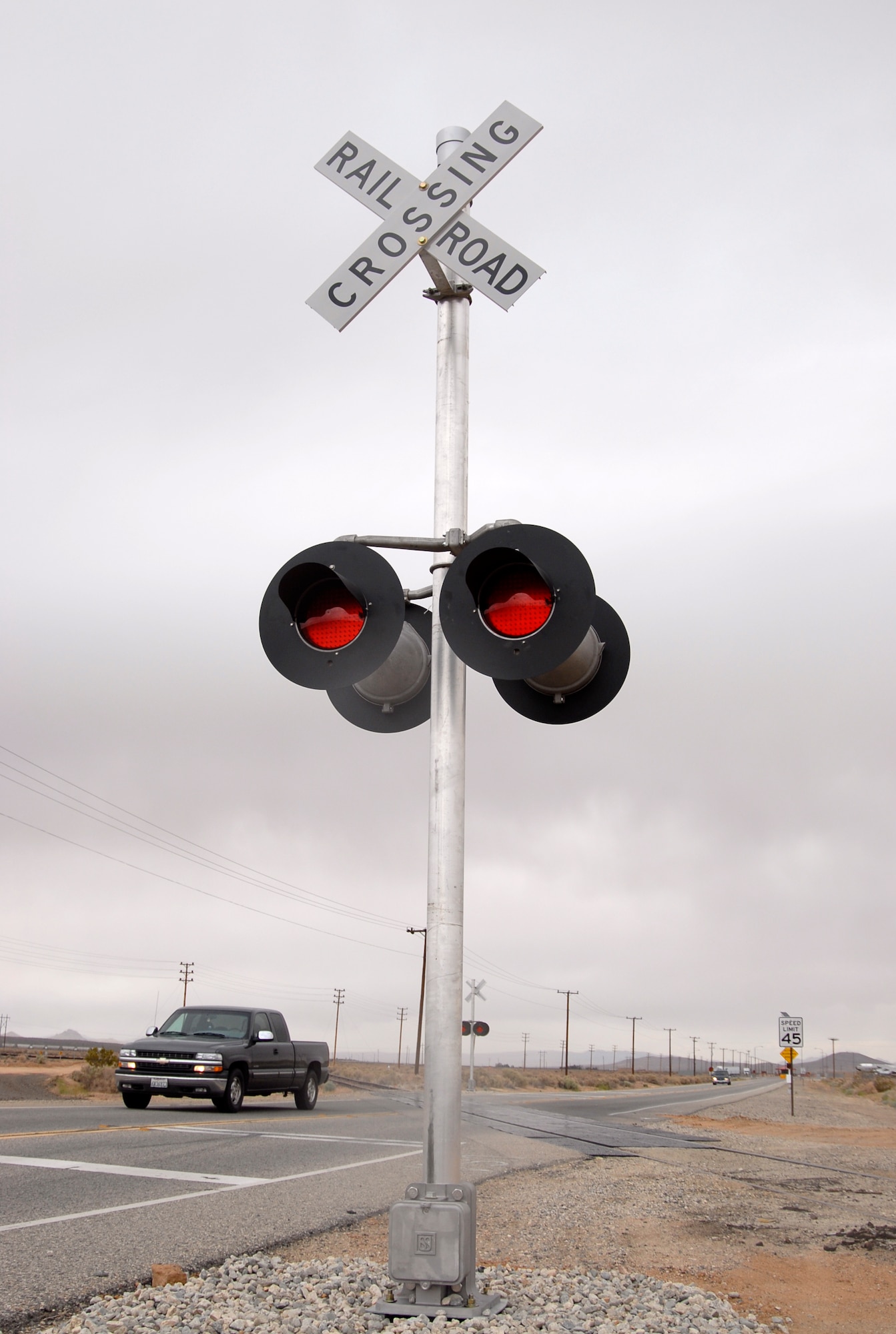 The 95th Civil Engineer and Transportation Directorate recently installed a railroad crossing traffic system for the Santa Fe Railroad that runs through Rosamond Boulevard, near the North Gate here. The traffic system will be operational for the ongoing new runway construction project. (Air Force photo by Senior Airman Julius Delos Reyes)